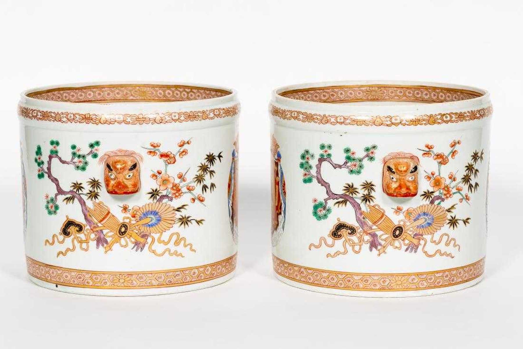 Chinese Export style armorial cachepots with mask handles. Finely decorated inside and out, marked with red cypher mark.