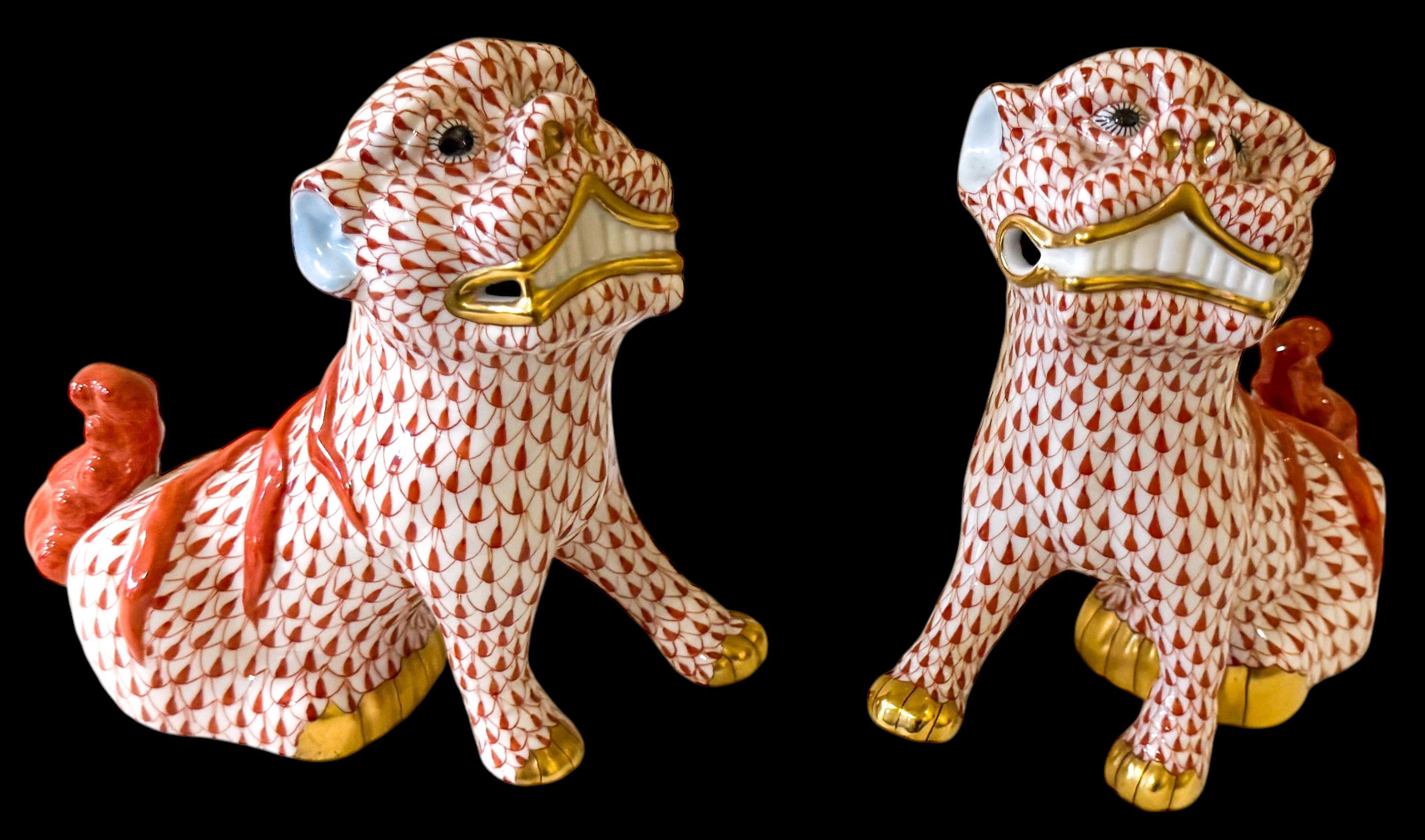 This is a lovely set of Chinese Export style Herend rust fishnet foo dogs with 24K gold accents. They are marked and in very good condition. They date to the 2000s.