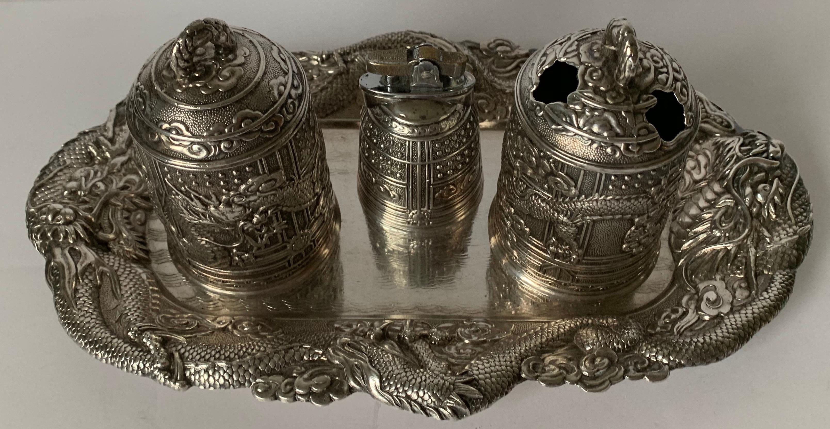Chinese export style Japanese silver plate smoking set. Three pieces plus tray. Tray is stamped on the underside. Tray is 12” wide x 7” deep.