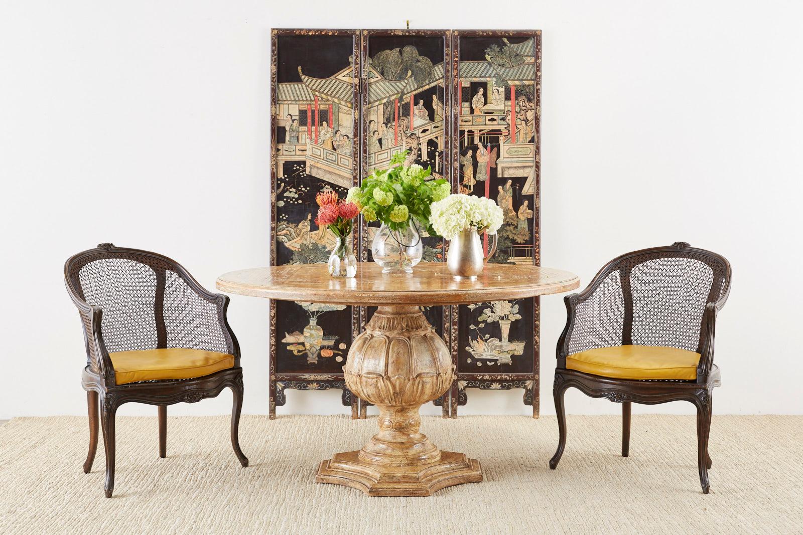 Beautifully distressed Chinese export three panel lacquered coromandel screen. Features images of elites in a courtyard with pagodas on one side and landscape scenes on the back, originally part of a larger screen the panels now have a lovely faded