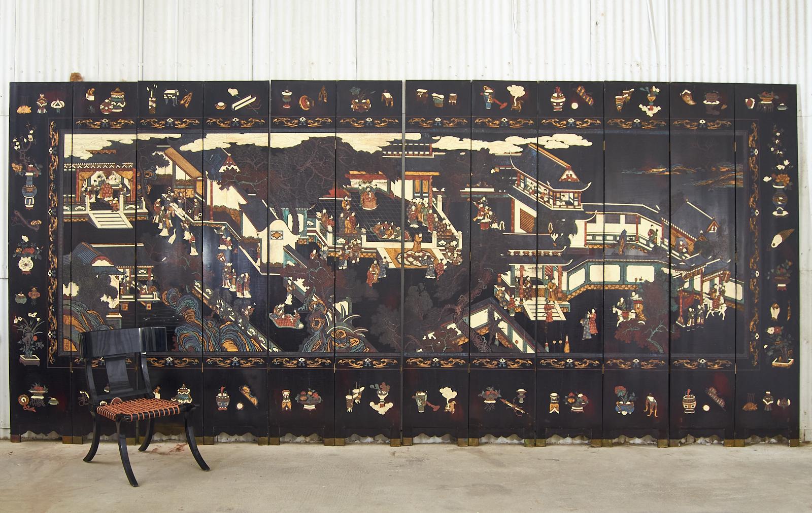 Monumental Chinese export twelve-panel lacquered coromandel screen depicting the 17th century ming dynasty motif 