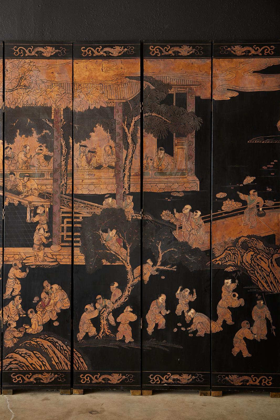 20th Century Chinese Export Twelve-Panel Lacquered Parcel-Gilt Coromandel Screen