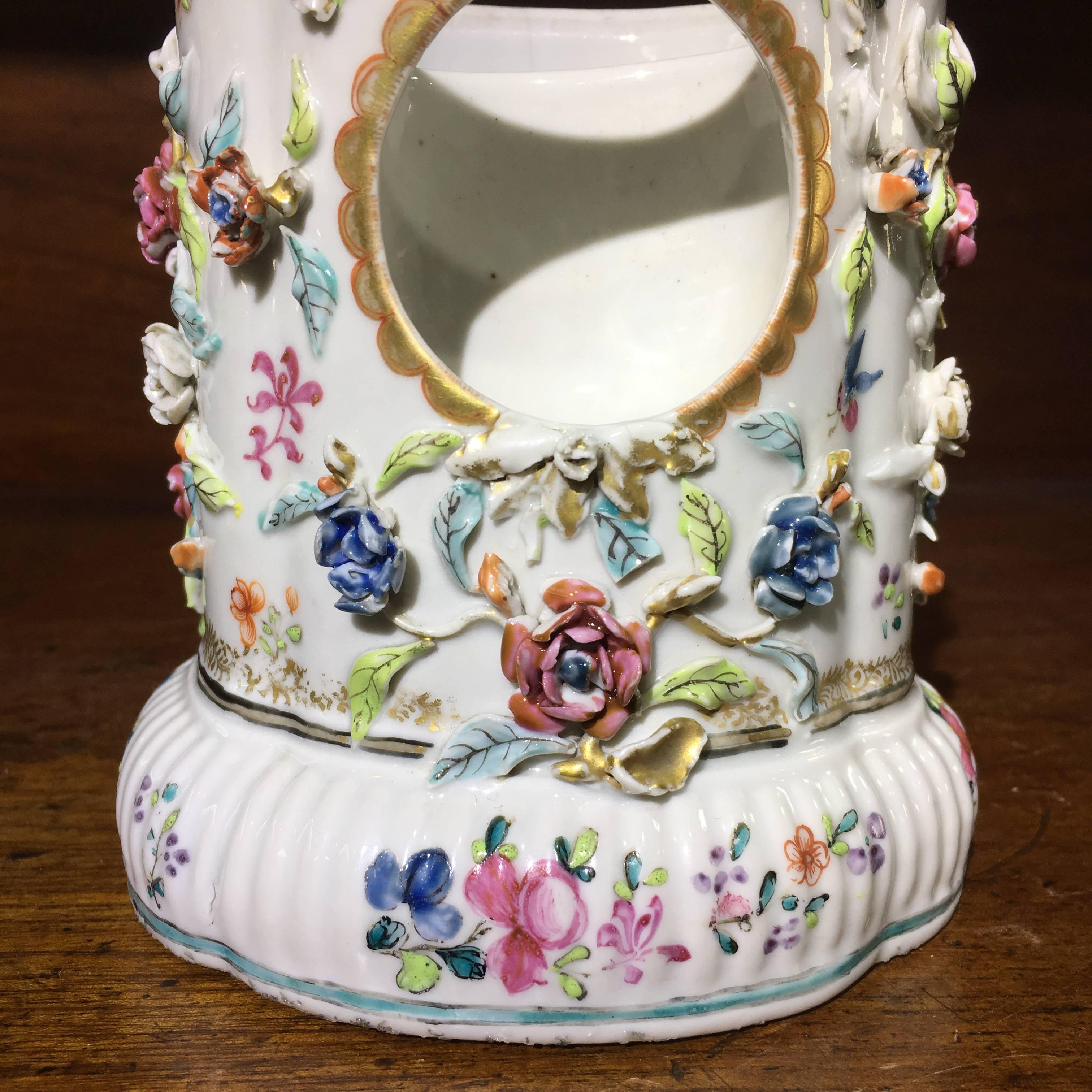 Chinese export watch stand, the straight sided form encrusted with colorful flowering vines, with gilt highlights, circa 1750.