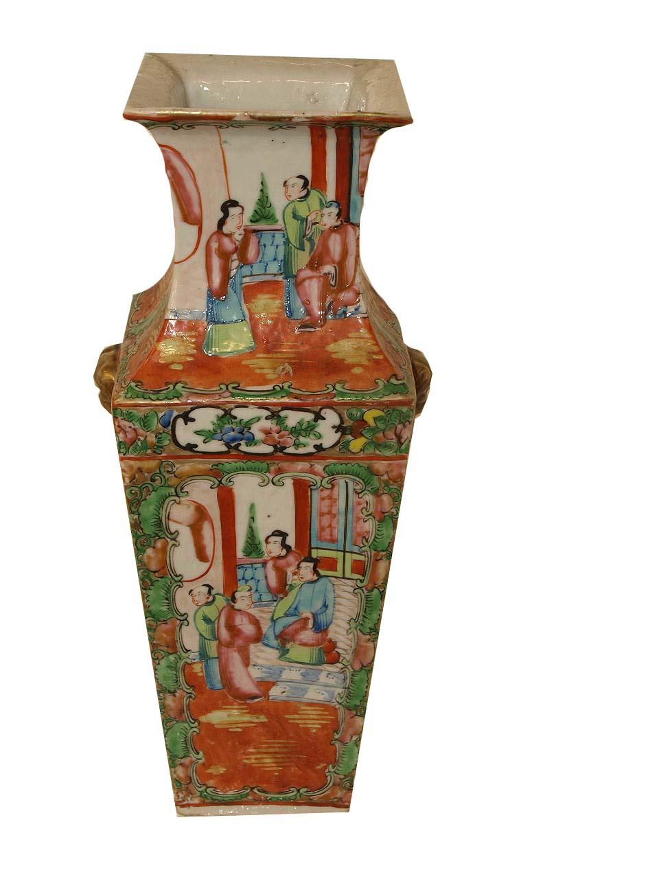 Chinese famile rose vase, with alternating scenes of flowers and birds( foo dogs holding rings) and groups of women, the diameter at the top is 3.88' and at the bottom is 2.88''.