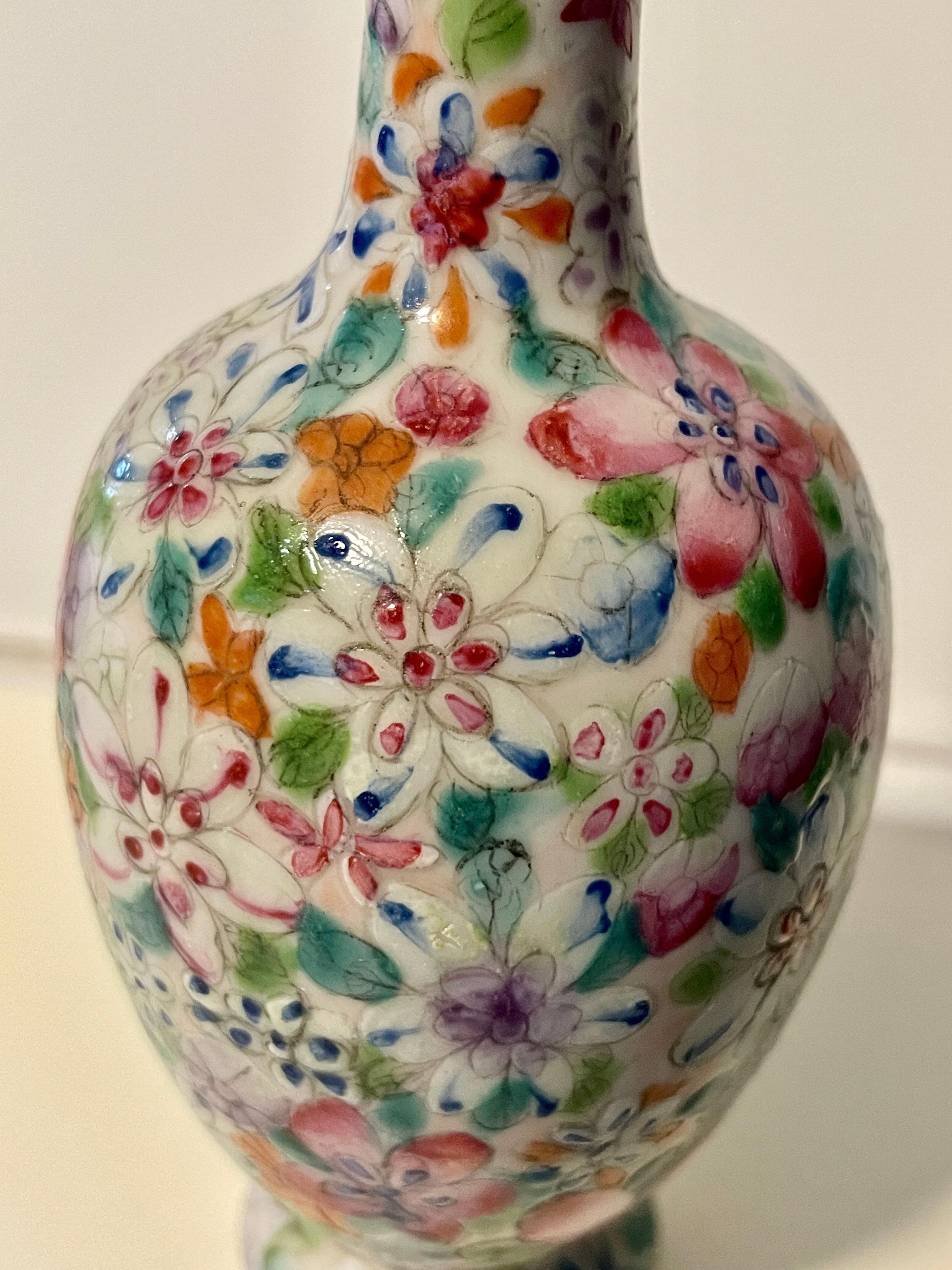 Lovely Chinese Famille Rose Millefleurs porcelain vase. Late Qing Dynasty to Republican Period. Baluster form with all over polychrome enamel floral decoration. Unmarked. From a California collection.