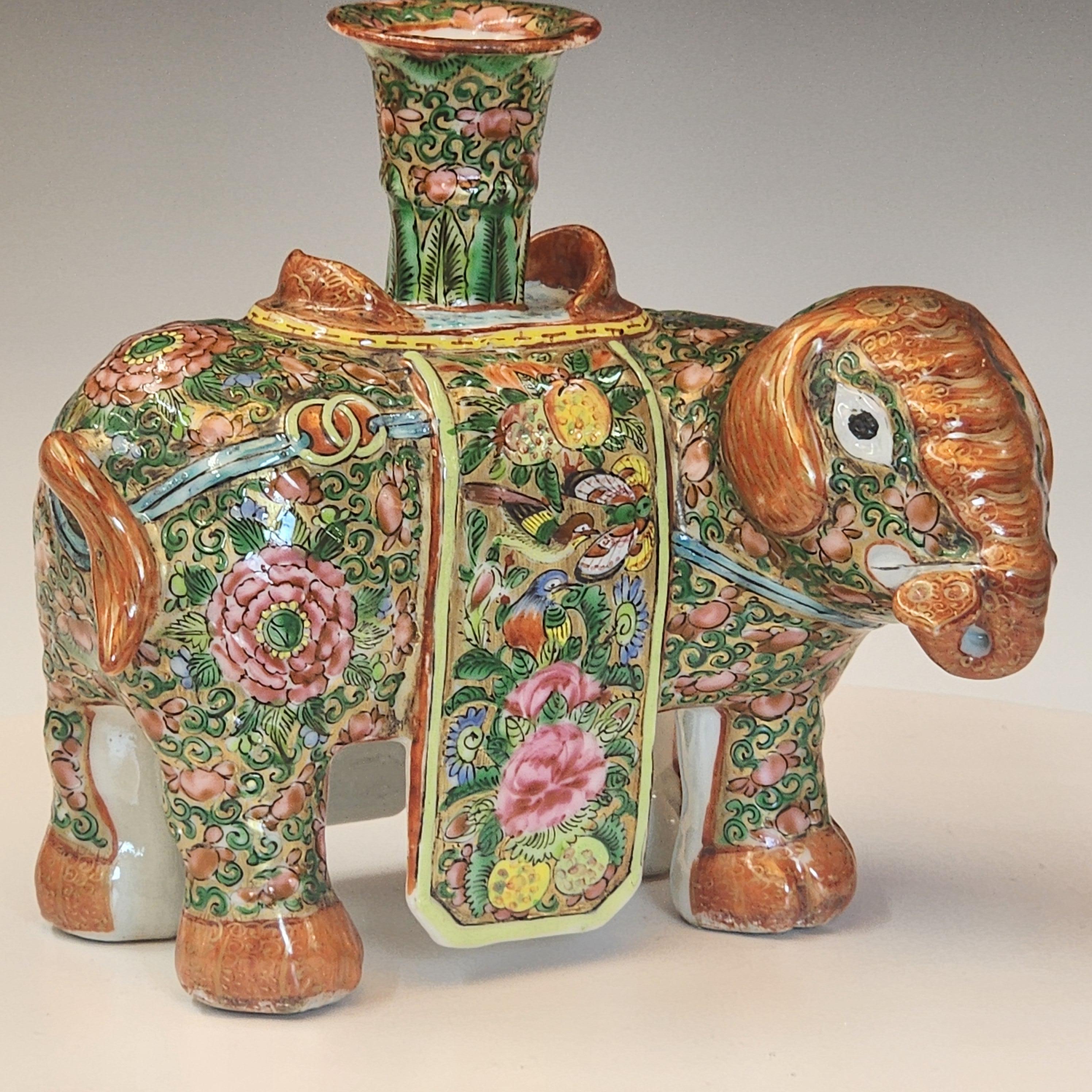 An exquisite Chinese porcelain joss stick holder dating to the early 19th century, crafted in the renowned famille rose palette. This piece is beautifully shaped in the form of a caparisoned elephant, a powerful symbol in Chinese culture