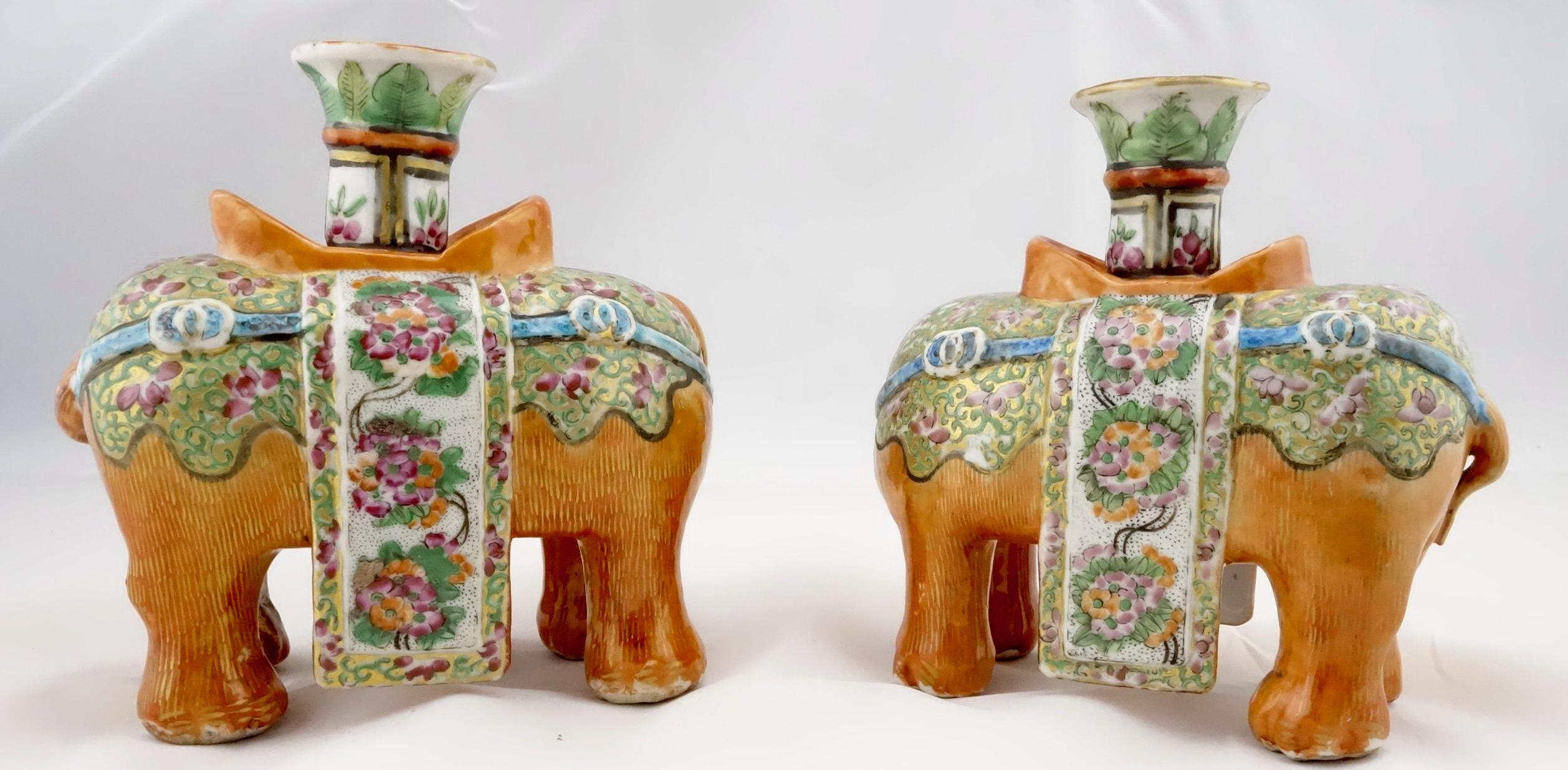 Chinese porcelain famille rose pair of joss or candlesticks from early 19th century. The joss sticks are in the form of caparisoned elephants. They are finely formed, enameled and gilded. Marked on the bottom with unknown marks. The dimensions are 5