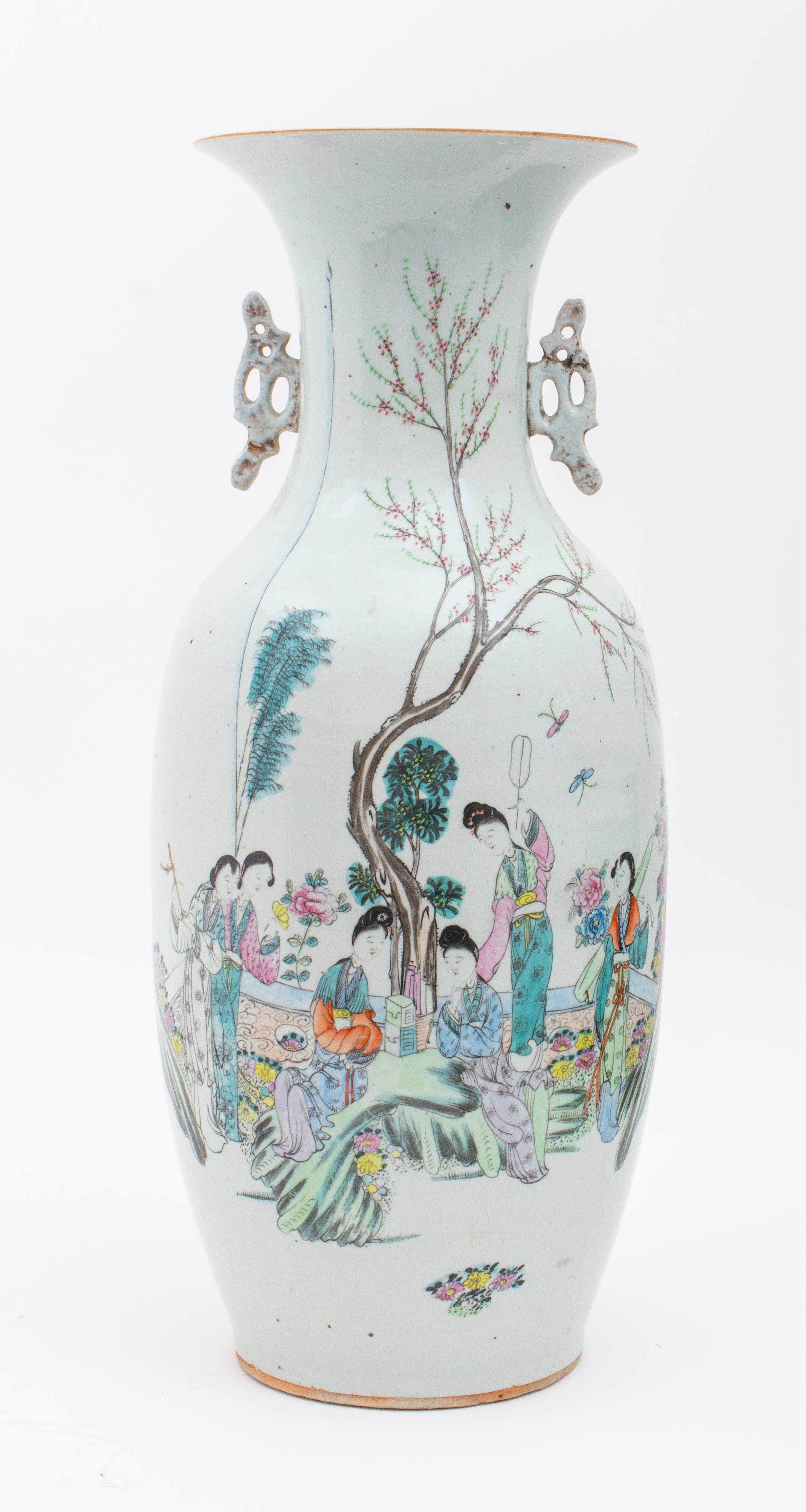 Chinese Famille Rose porcelain baluster vase, depicting a group of court ladies under a cherry blossom tree, with Chinese characters on verso, unmarked. Measure: 22.75
