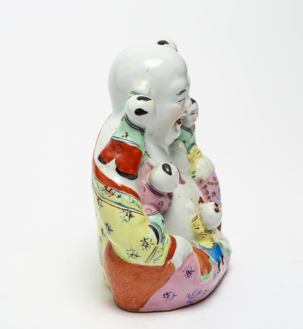 Chinese famille rose porcelain and poly-chrome enamel Hotei Laughing Buddha figure with five boys, probably dating from the Republic Era. The piece has an elaborately painted robe, the underside has a stamped maker's mark and impressed numbers. In