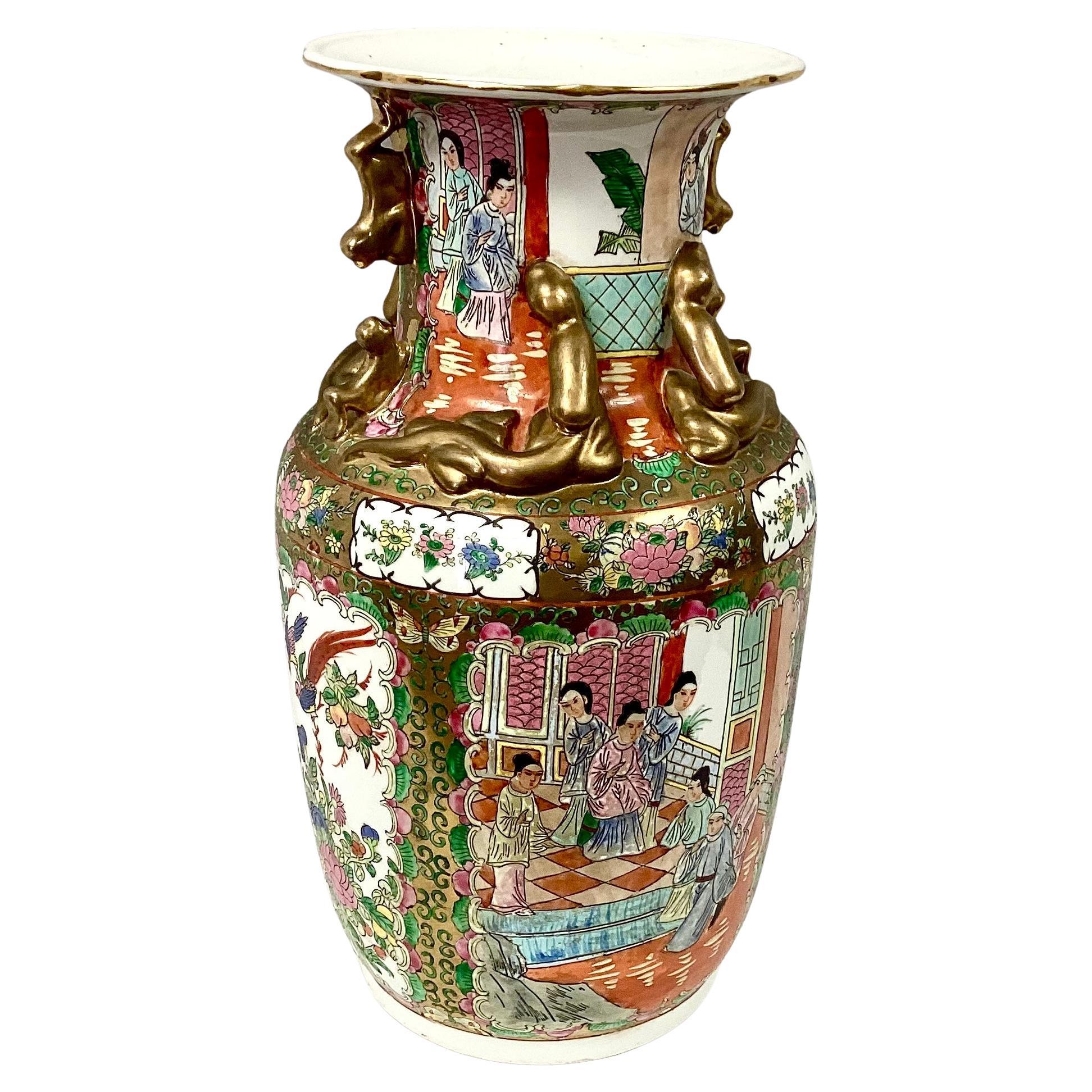Chinese Famille Rose porcelain vase. Decorated with birds, flowers, and figures of the era with gold figures on neck and gold trim. Chinese signature mark on bottom. Early 20th century.