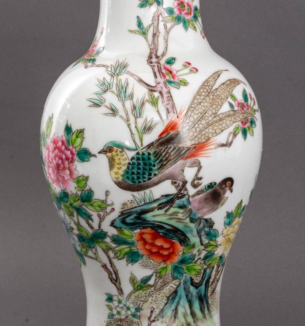 Pair of Famille Rose Glazed Porcelain Vases Mounted as Table Lamps, each hand-painted with birds amongst lotus flowers with calligraphy marks to body, mounted on wood bases. 20.25