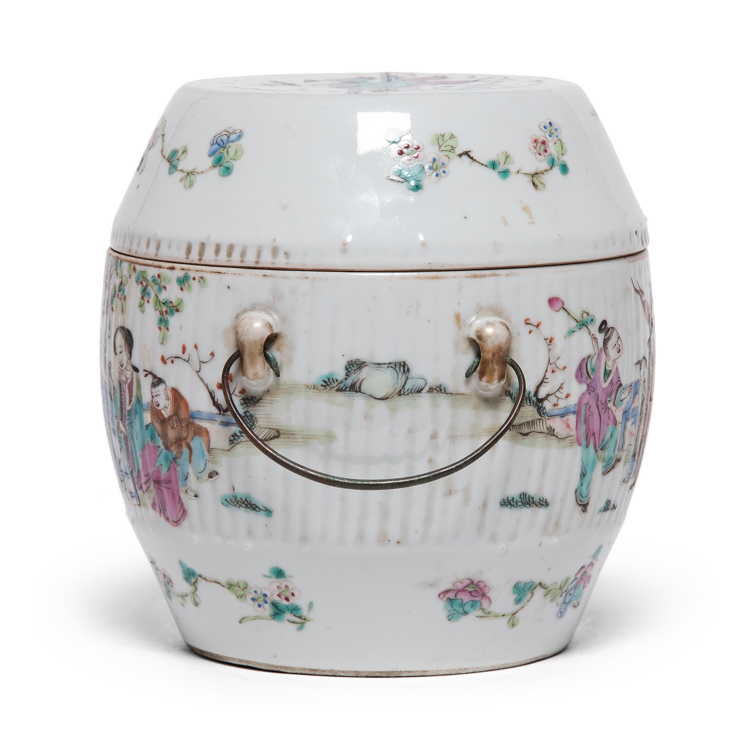 This early 20th century covered jar takes its rounded shape from serving tureens used to serve soups and stews. Contrasted by a crisp white field, the lid and sides are decorated with a lively scene of children at play in a courtyard garden.