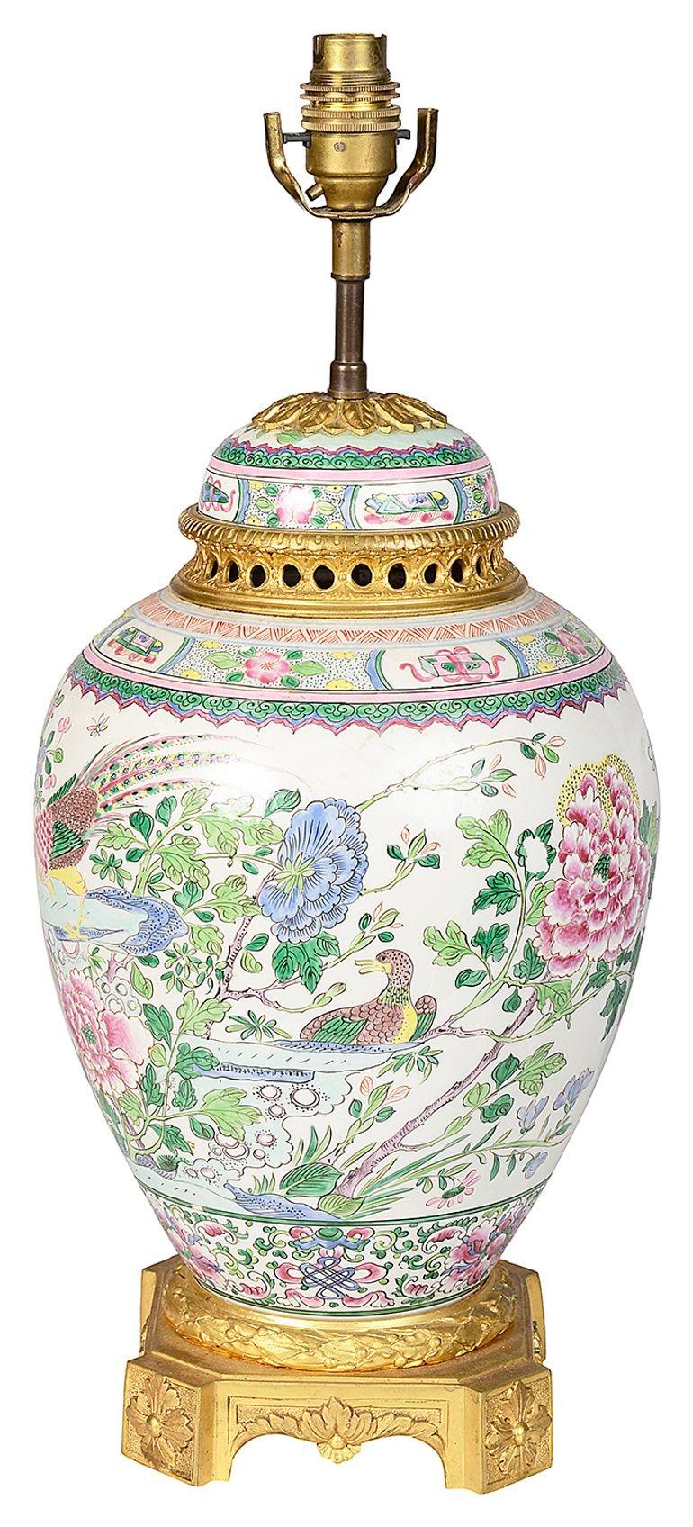 A very good quality 19th Century Chinese Famille Rose lidded jar, having wonderful exotic flowers and birds all hand painted, mounted with gilded ormolu lid, collar and base.
 
Batch 73 G9919/23. SKZN