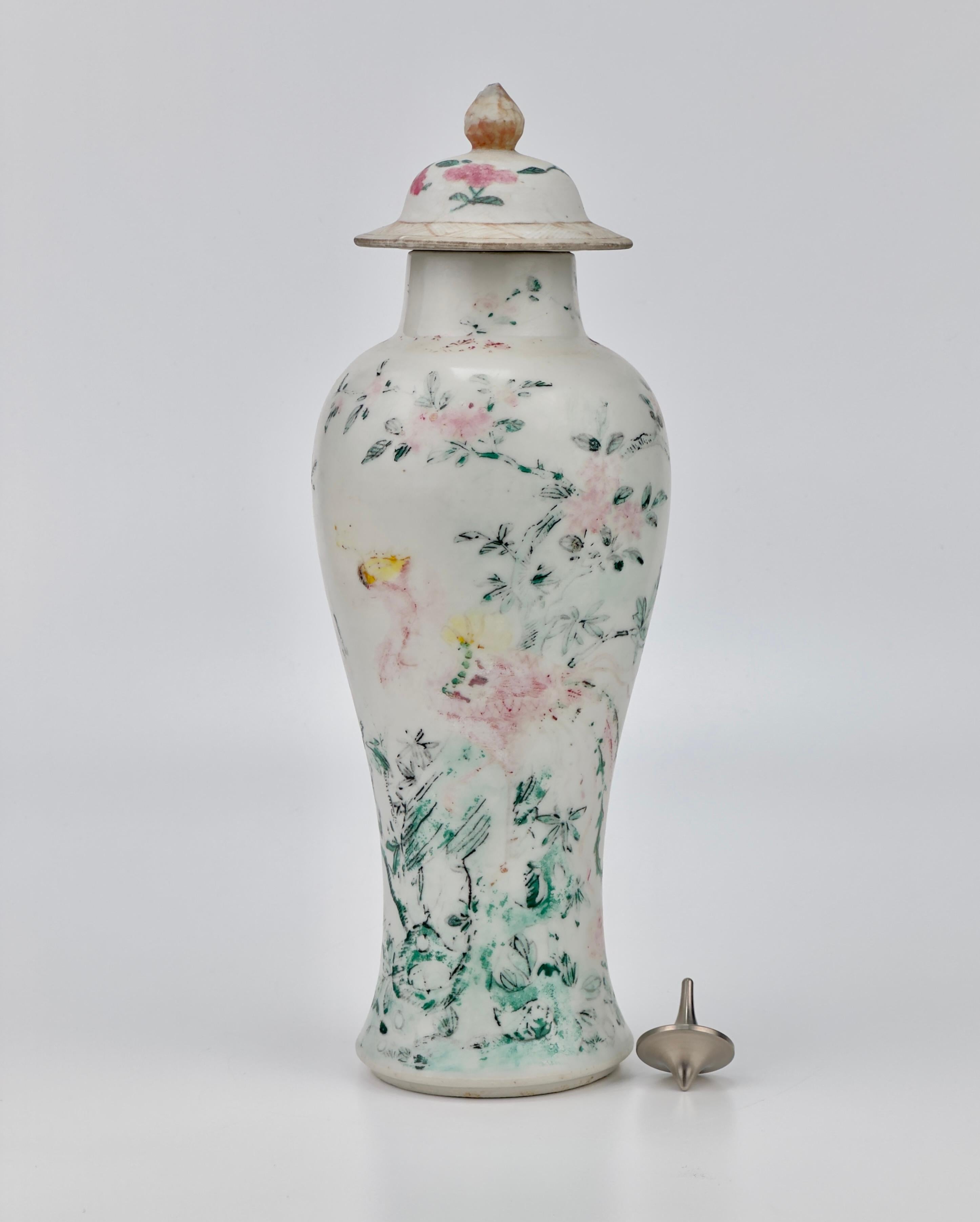The vase's form is elegant, with a tapered body and domed lid with long line of body, crowned with a delicate finial, embodying the sophistication and high aesthetic standards of Qing porcelain.

This piece is from the early Qing dynasty, and it is