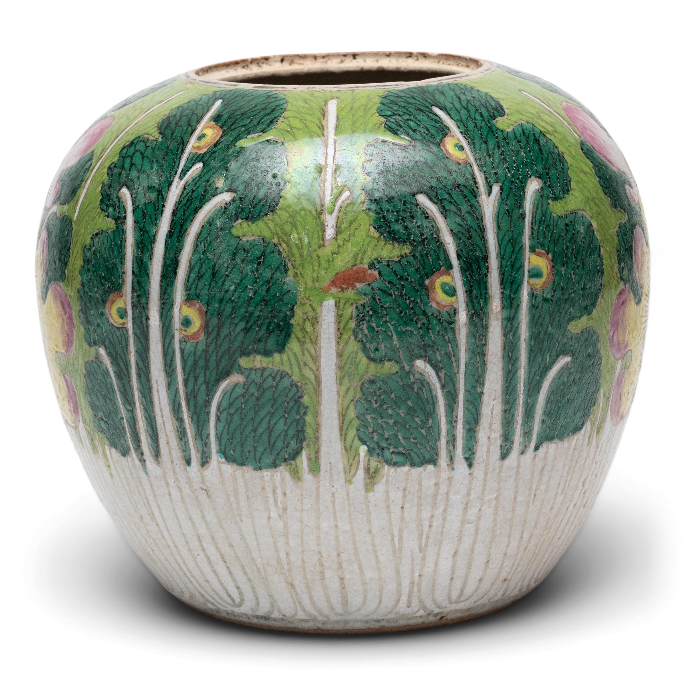This whimsical Chinese ginger jar is decorated with famille verte enamels for an allover design of leafy green cabbage. Depicting the white stalks and curling leaves of a head of napa cabbage or bok choy, the enameled decoration is finely brushed