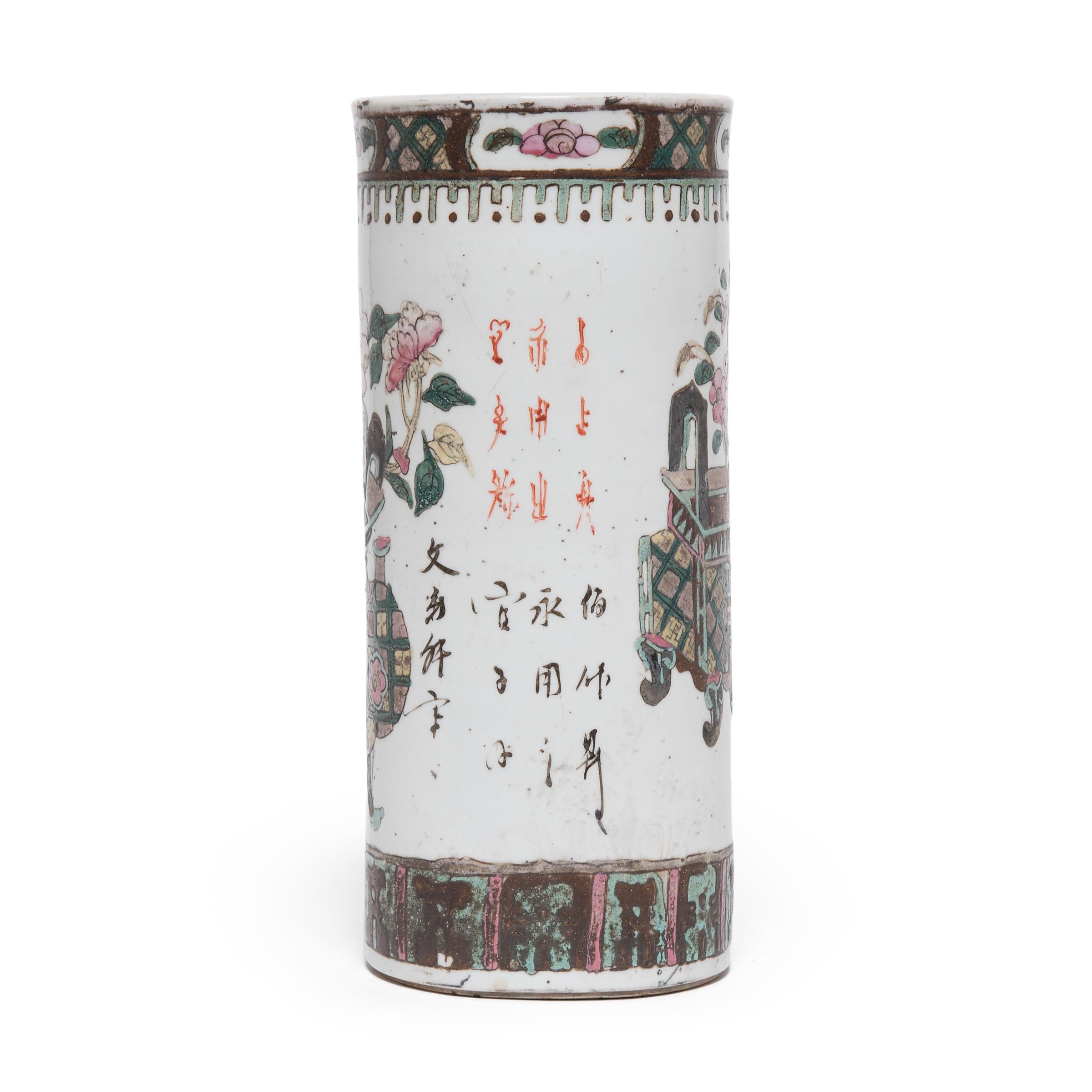 Dated to the late 19th century, this porcelain hat stand was once used by a Qing-dynasty gentleman to display his cap while it wasn't being worn. The hat stand is decorated in the famille verte style, a decorative technique that employs opaque