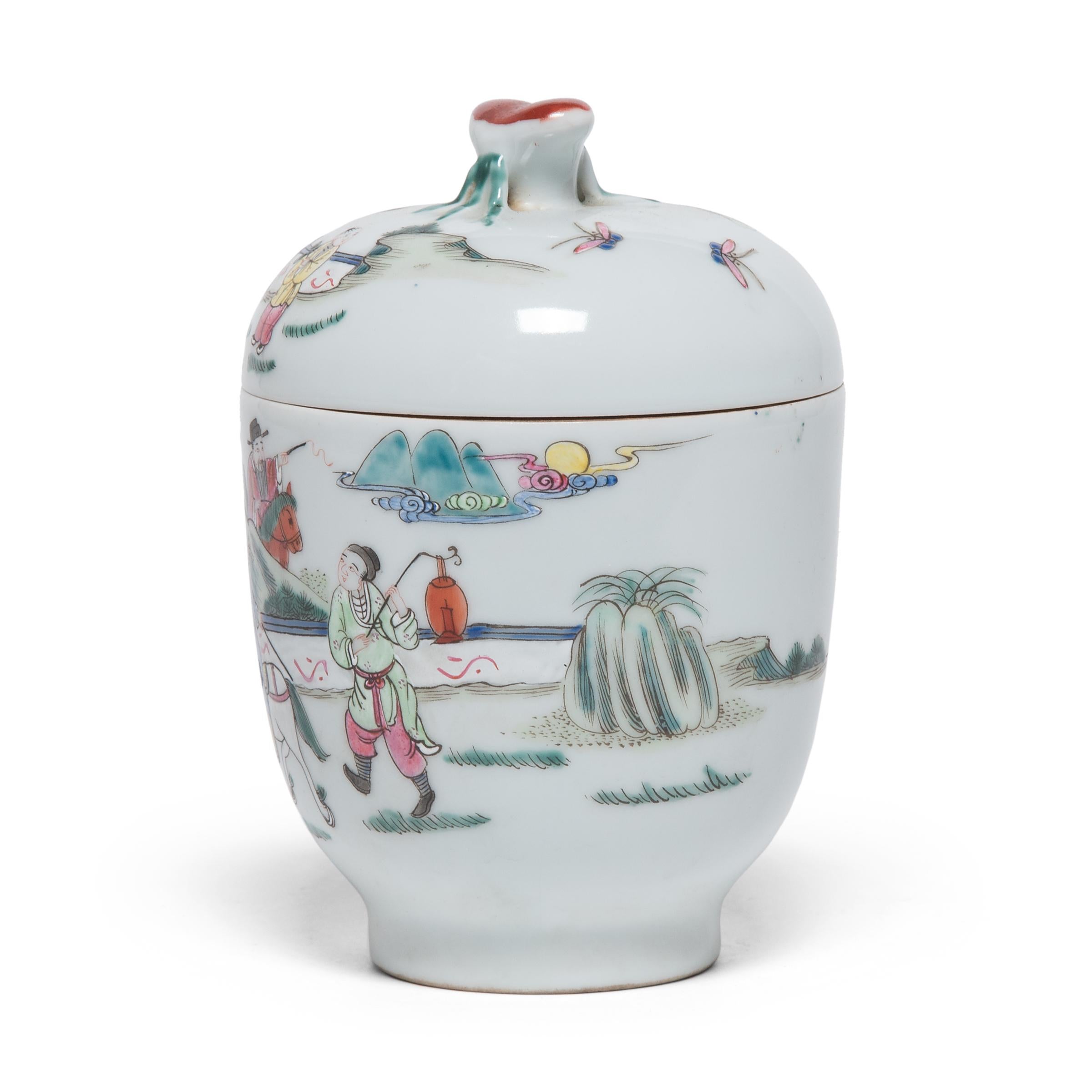 This petite oval jar is decorated with colorful and bold enamels in the style of famille verte porcelain ware. Made with a highly refined paste resulting in an exceptionally fine grade of ceramic ware, famille verte porcelain is identifiable by its