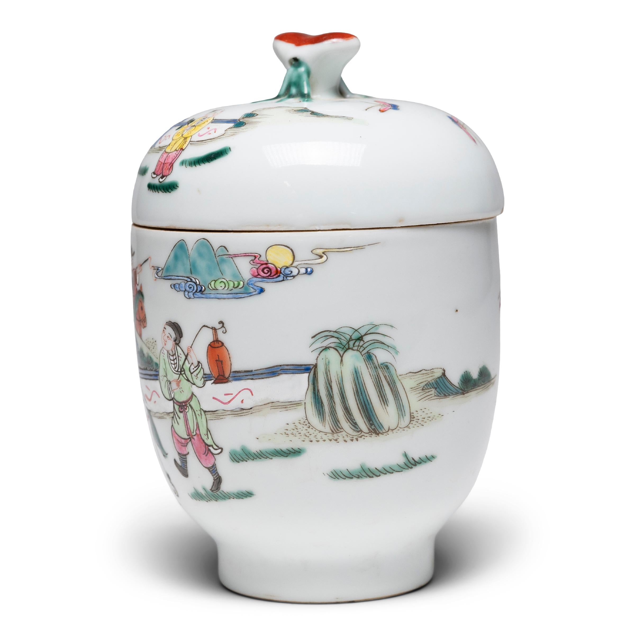 This petite oval jar is decorated with colorful and bold enamels in the style of famille verte porcelain ware. Made with a highly refined paste resulting in an exceptionally fine grade of ceramic ware, famille verte porcelain is identifiable by its