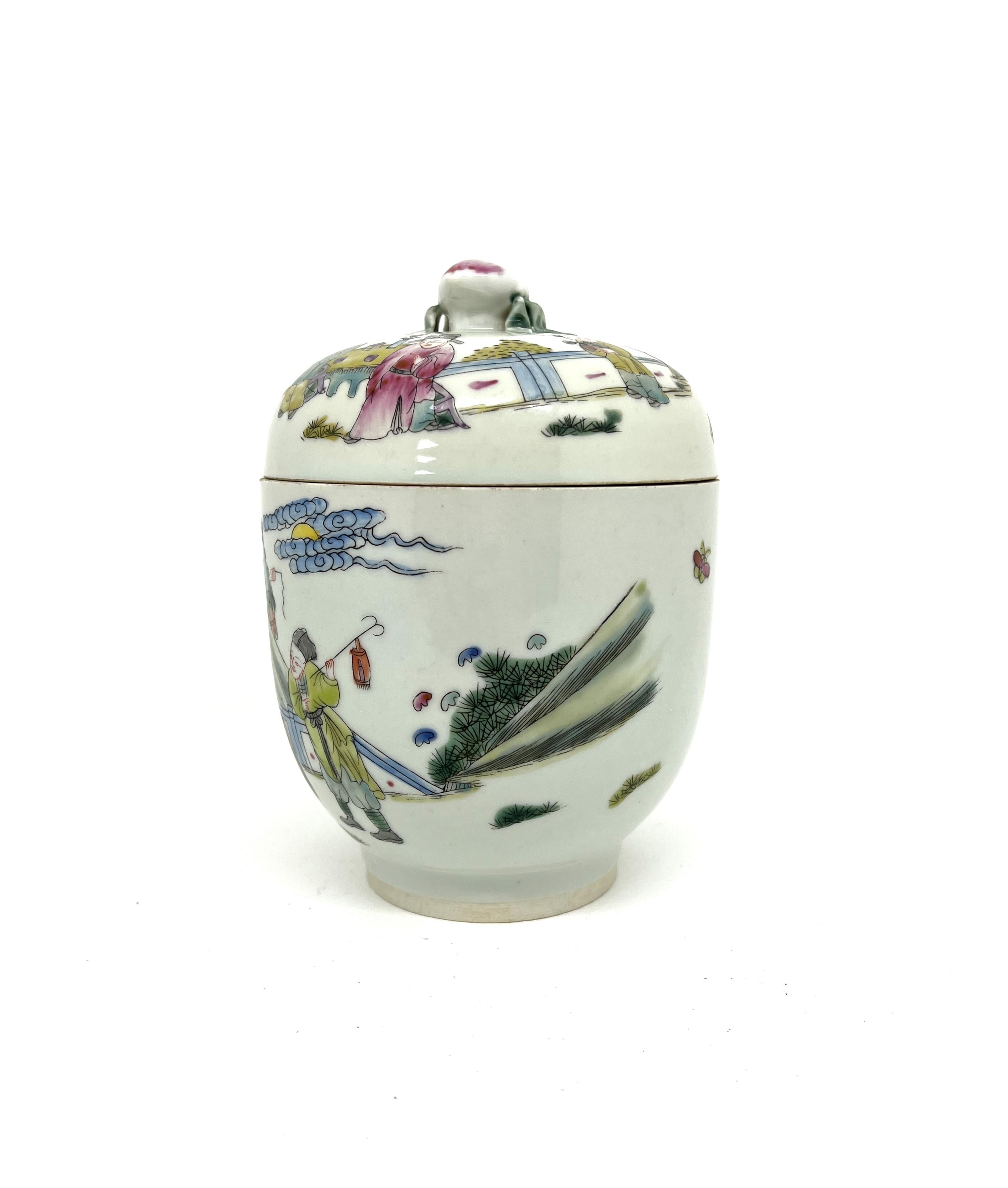 This small, oval-shaped jar features vibrant and striking enamels characteristic of famille verte porcelain. Crafted from an exceptionally refined paste, it belongs to a superior quality of ceramic ware. Famille verte is distinguished by its