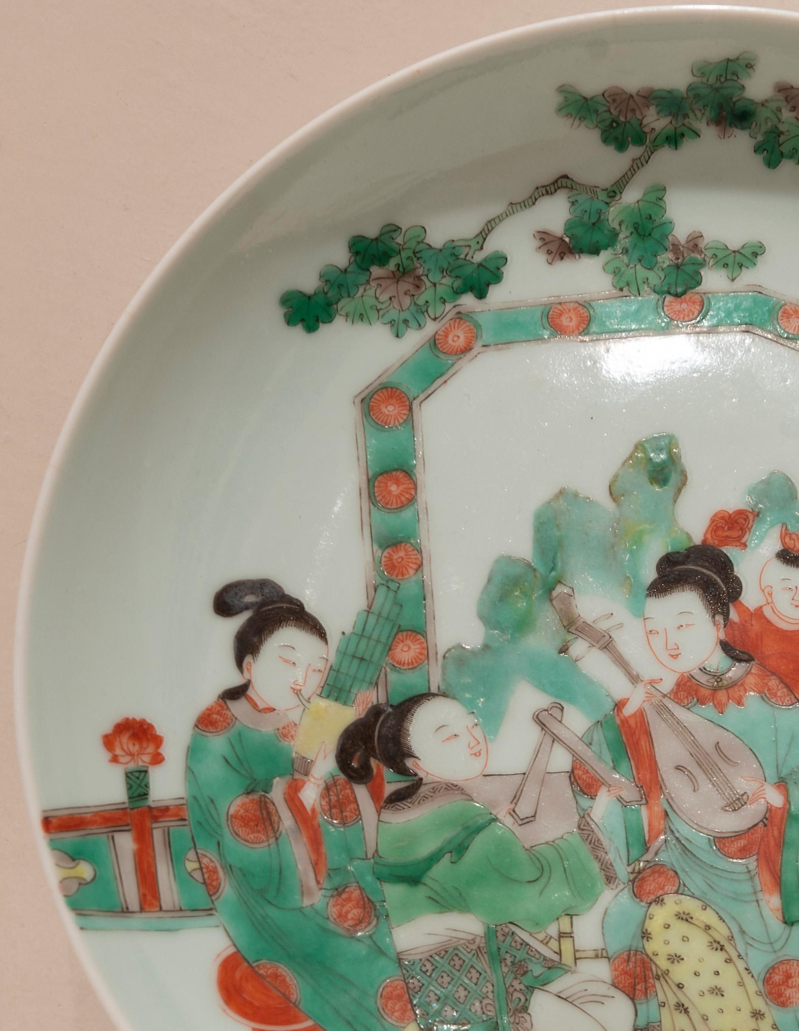 Porcelain dish depicting women playing music in a garden.