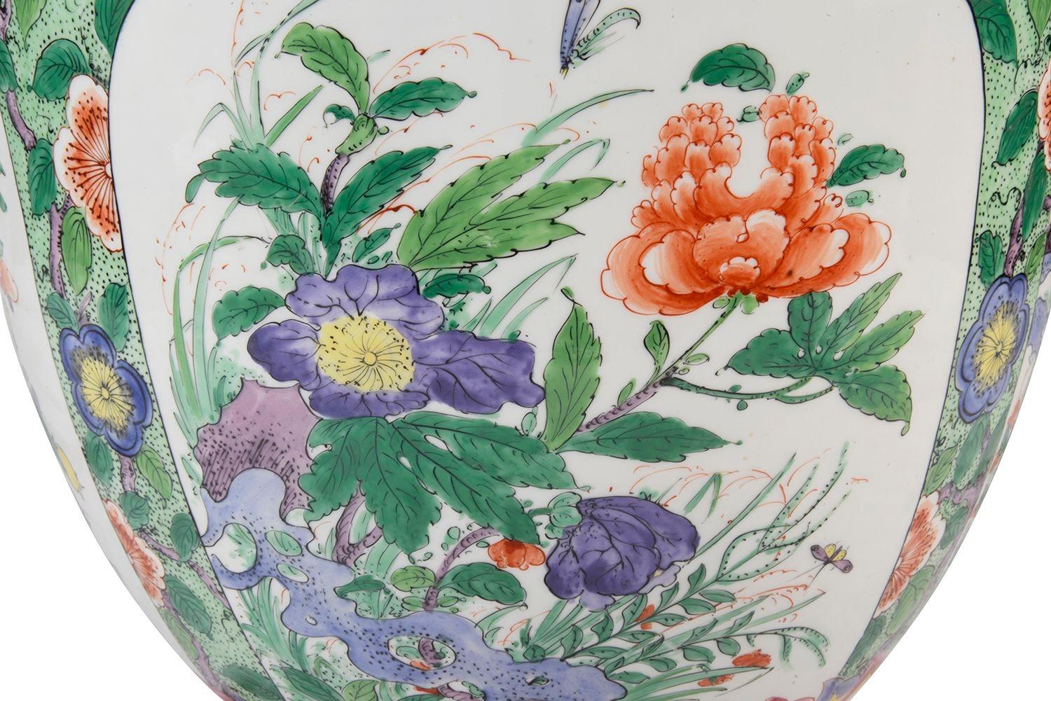 A very decorative late 19th Century Chinese Famille Verte style Samson porcelain jardinière. Having wonderful bold green ground with motif, floral and foliate decoration. Inset hand painted panels depicting exotic flowers and butterflies.

Batch 76