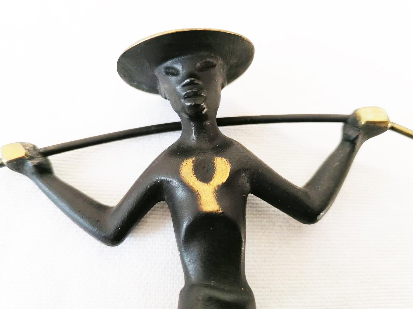 Brass figurine blackened Chinese water carrier with a salt pepper Horn Shaker. Designed in the 1950s by Richard Rohac in Austria.
Excellent original condition.