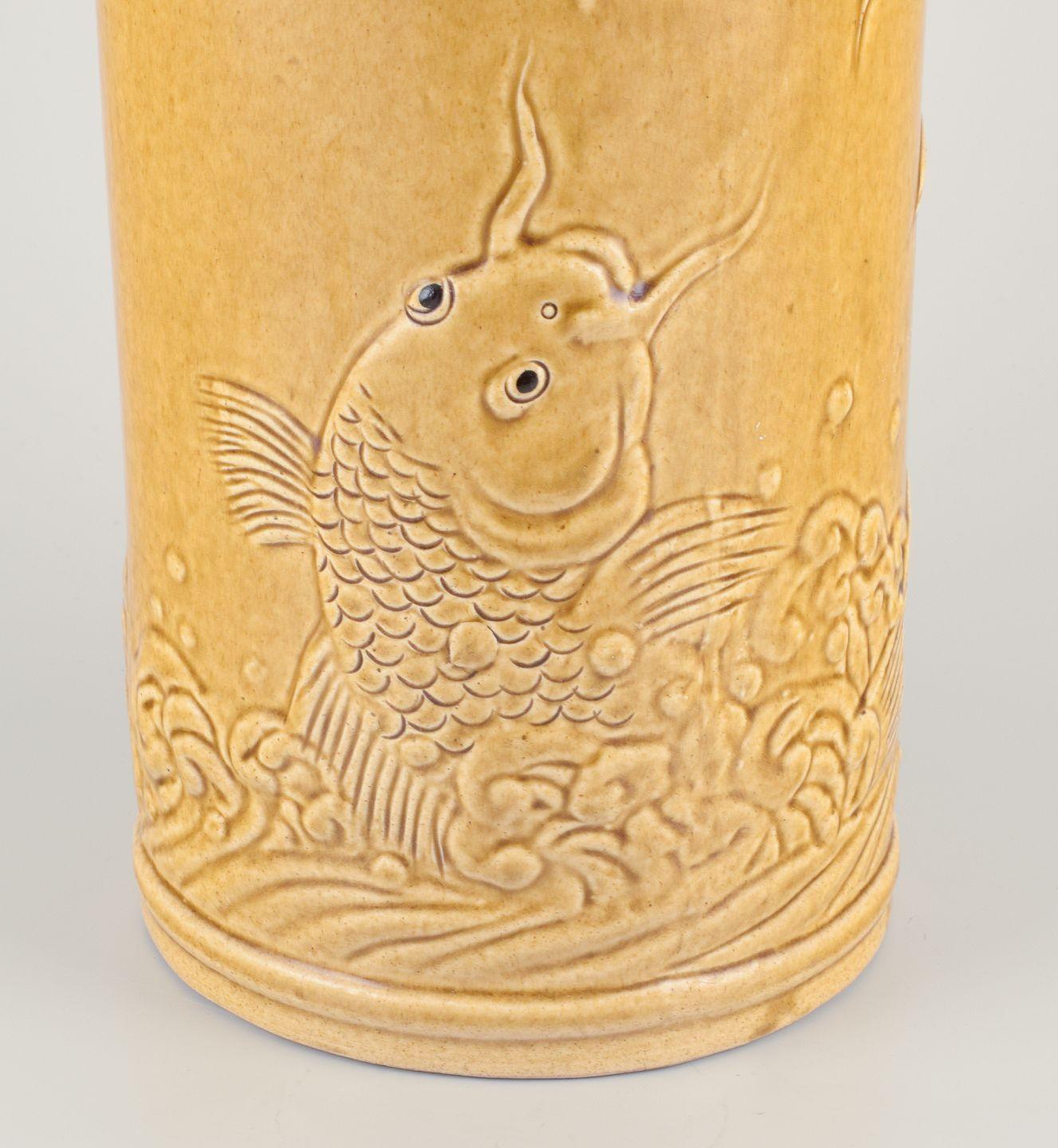 20th Century Chinese floor vase made of earthenware. Motif of fish on the seabed. For Sale