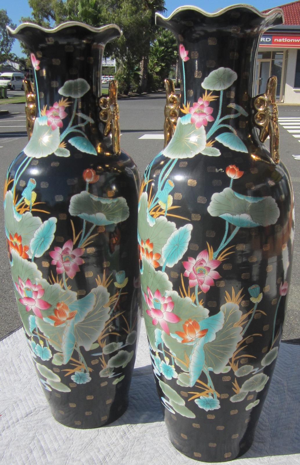 Pair of Chinese large ceramic floor vases / temple vases,
noir lotus flower decoration with gold plating,
no markings on bases,
weight 35kg each.
Our eclectic stock crosses cultures, continents, styles and famous names.
 