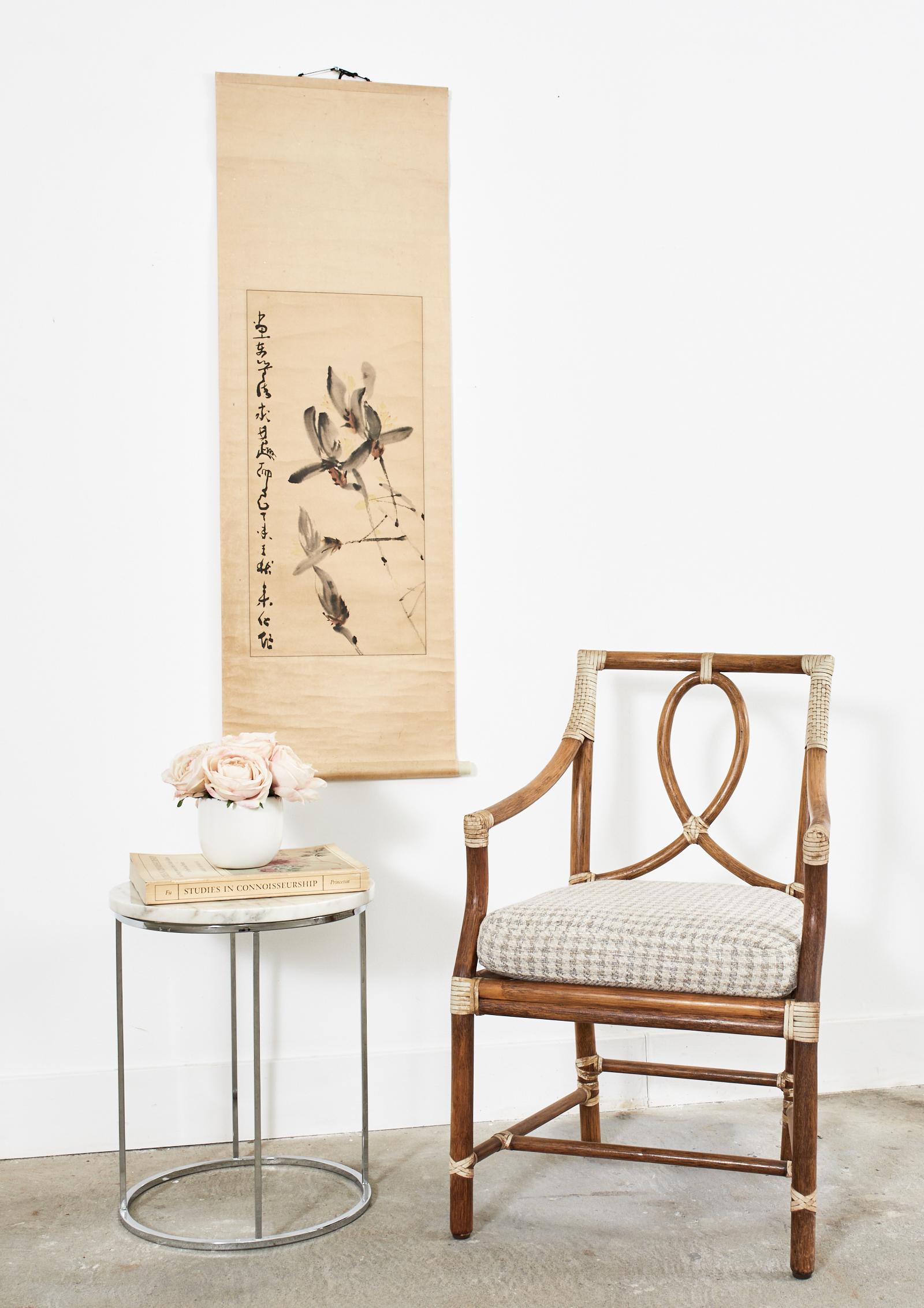 Seasonal autumn Chinese hanging scroll featuring a painting of delicate flowers with a calligraphy signature and date. Crafted on hand-made mulberry paper with a silk tie on the top and a wooden digan round bar on the bottom with decorative