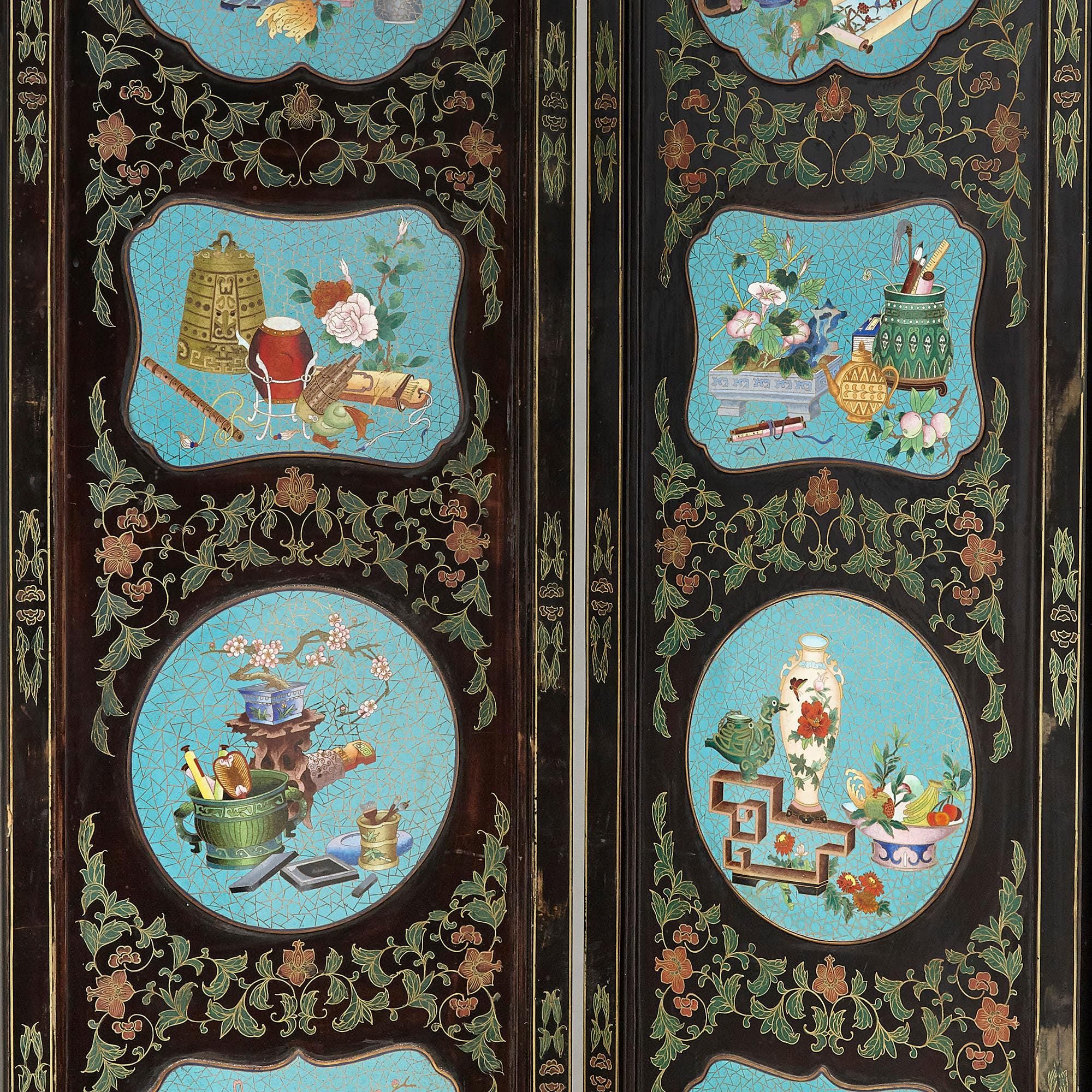 Chinese folding screen mounted with cloisonné enamel panels
Chinese, early 20th Century
Opened: Height 185cm, width 264cm, depth 3cm
Closed: Height 185cm, width 44cm, depth 18cm

This fine Chinese folding screen is crafted from lacquered wood