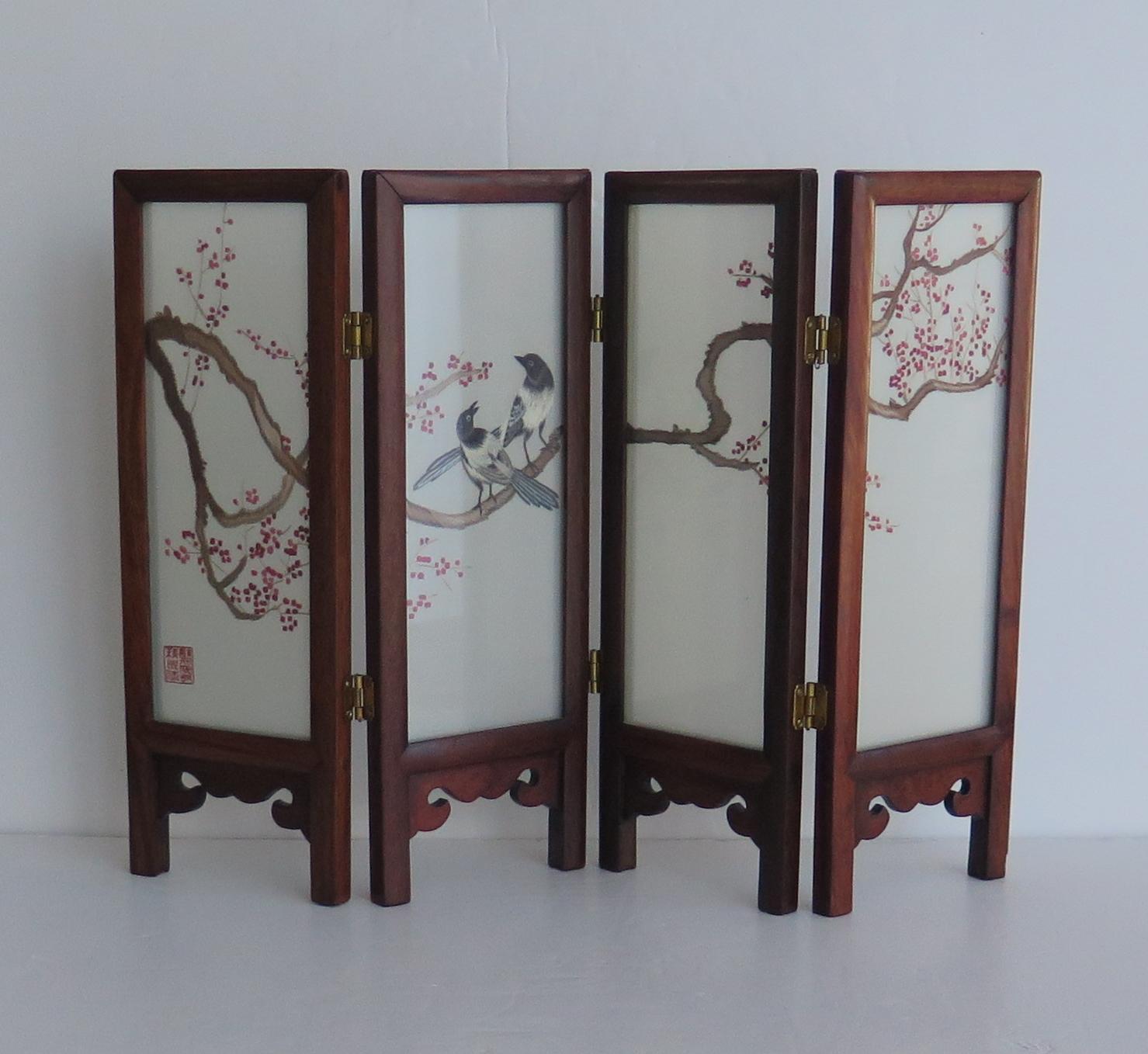 This is a very decorative Chinese folding desk or table screen with hardwood frame and silk panels with hand embroidered decoration, dating to circa 1960s 

The piece is all hand made. 

It has four panel screens with hardwood mitre jointed frames,