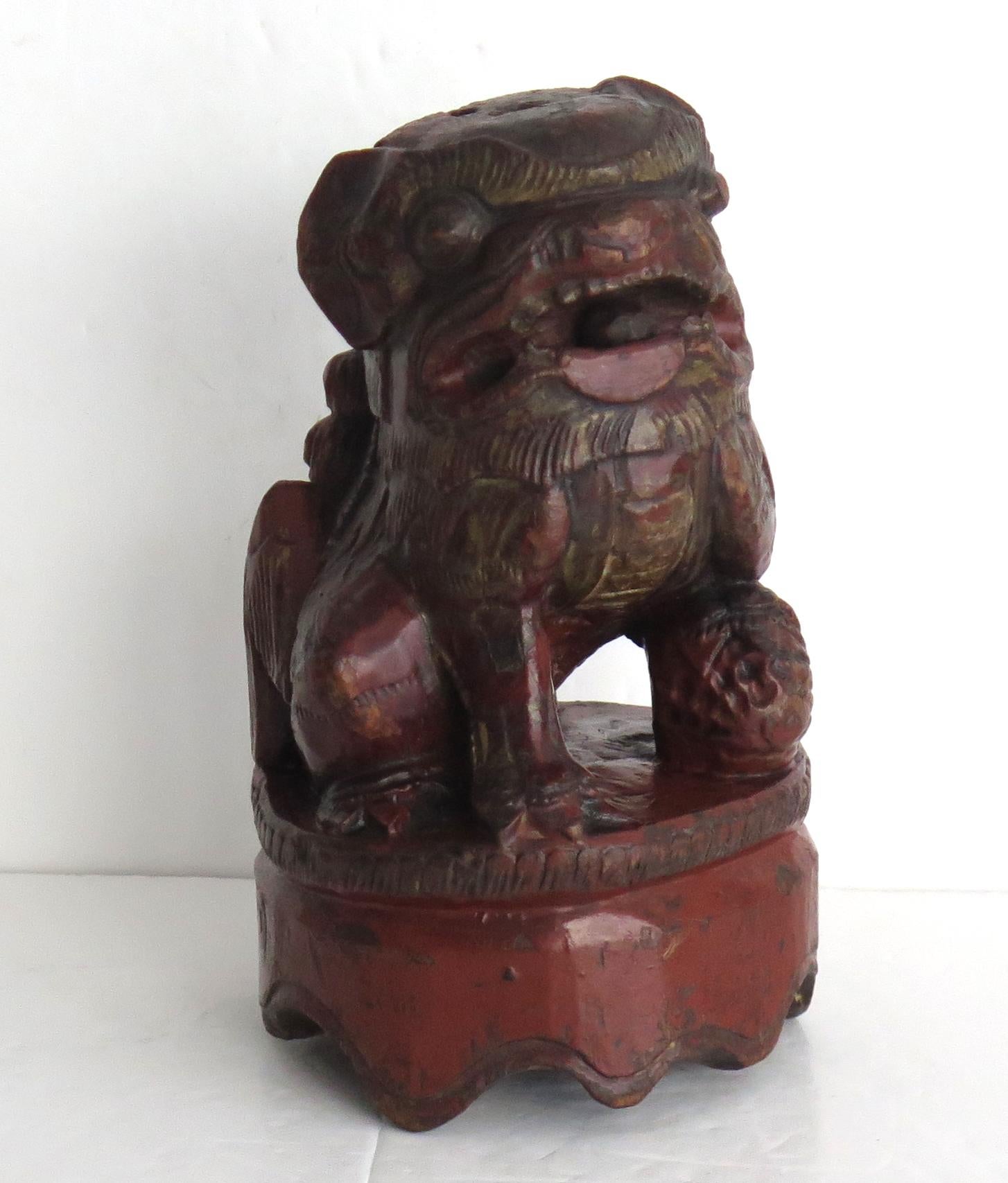 This is a good Chinese hand carved bamboo Foo or Lion Dog, sometimes called a temple lion that we date to the 19th Century Qing period.

The piece is hand carved from a piece of bamboo, as a fierce dog or lion sat on a circular base, with a