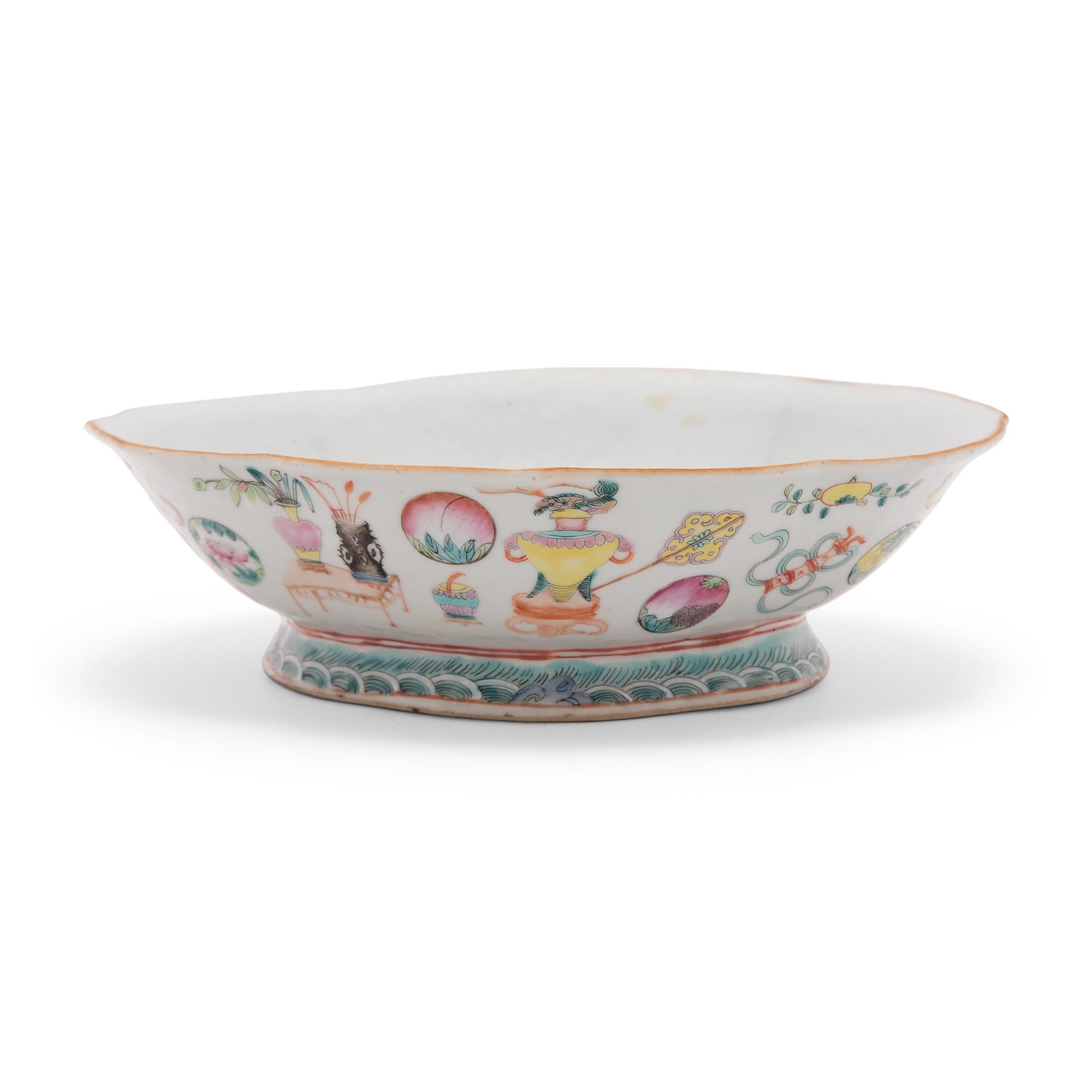 This colorful porcelain bowl dates to the mid-19th century and was originally used as a serving dish for ritual offerings, placed before an altar and piled high with fruit, baked goods, and other foods. The cartouche-shaped dish features tall sides
