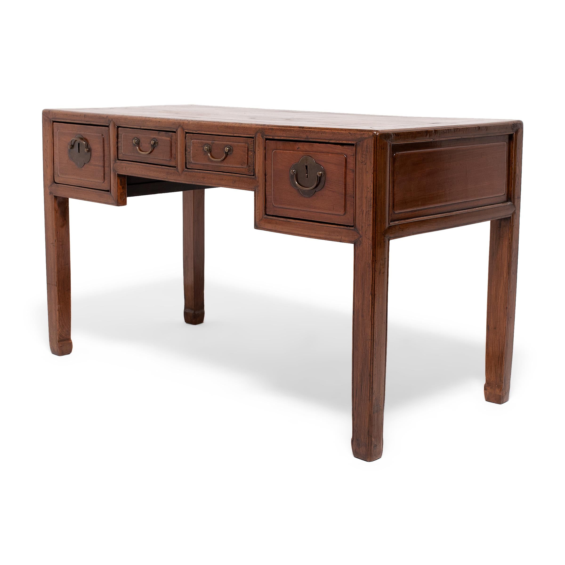 This four-drawer writing desk once stood centerpiece in the office of a well-to-do professional of the late Qing-dynasty. Desks with drawers such as this didn't become popular in China until the 19th century, and were strongly influenced by Western