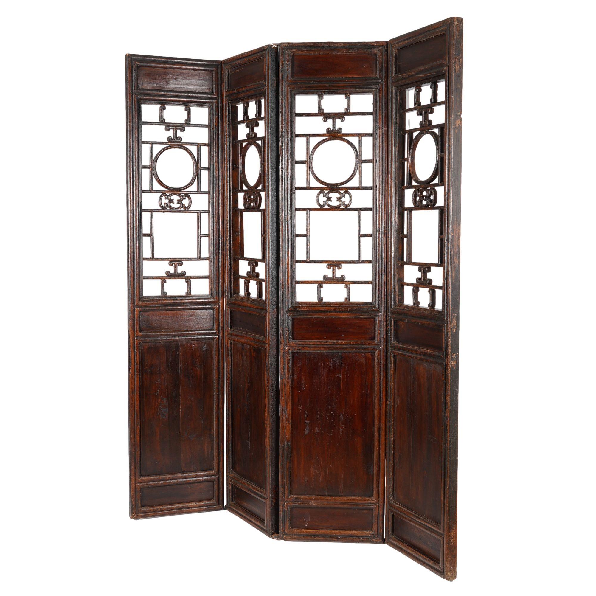 Four hardwood panel & lattice-work passage screens. The surface retains its original, though distressed, finish. Panels have been hinged together at a later date.

China, first half 19th century.