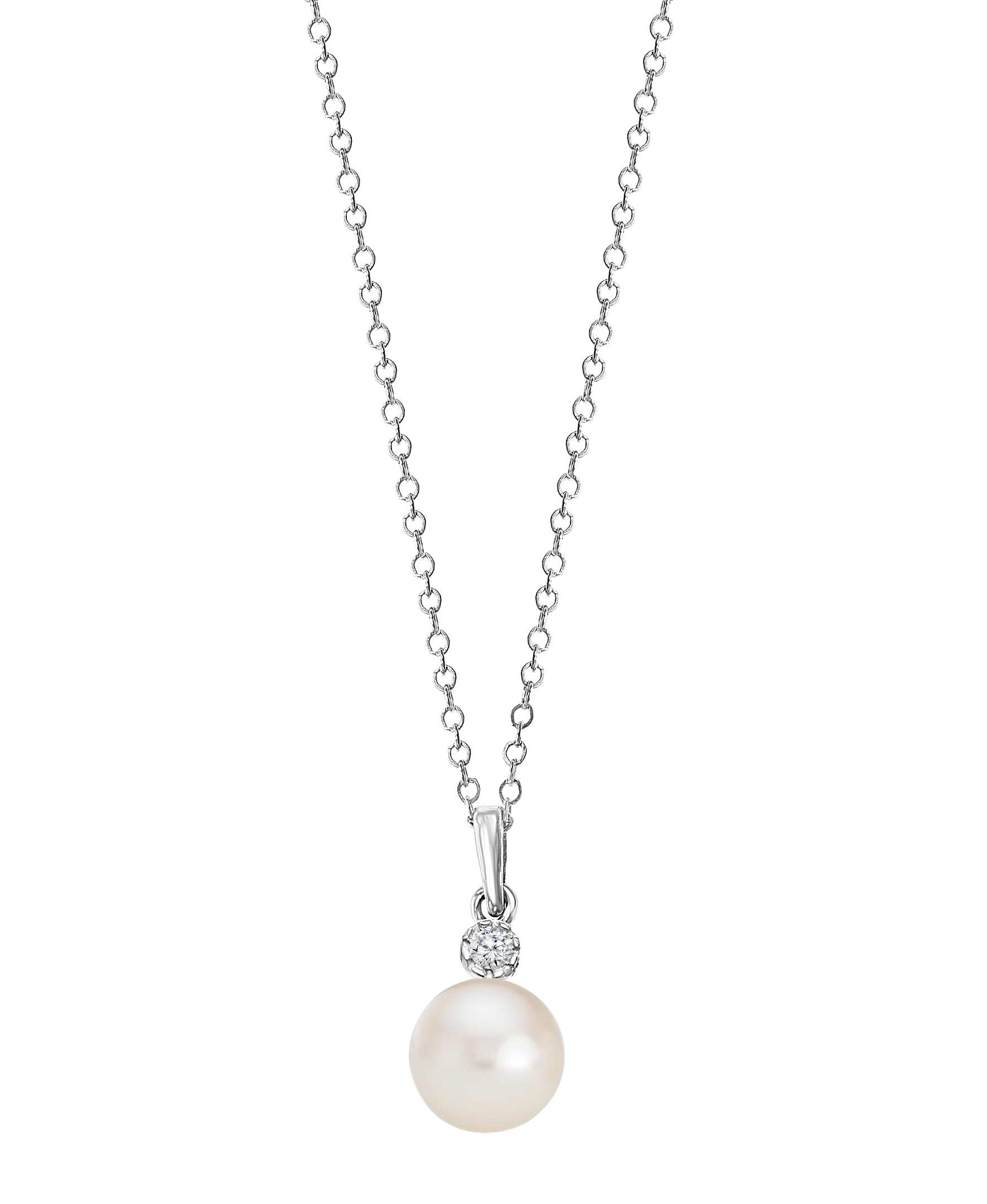 This Chinese freshwater cultured, white round pearl is set beneath a single round diamond. The pearl measures 8-8.5 and the diamond is 0.03 carats. The pendant is set on 14K white gold with an adjustable chain that has a maximum length of 18 inches.