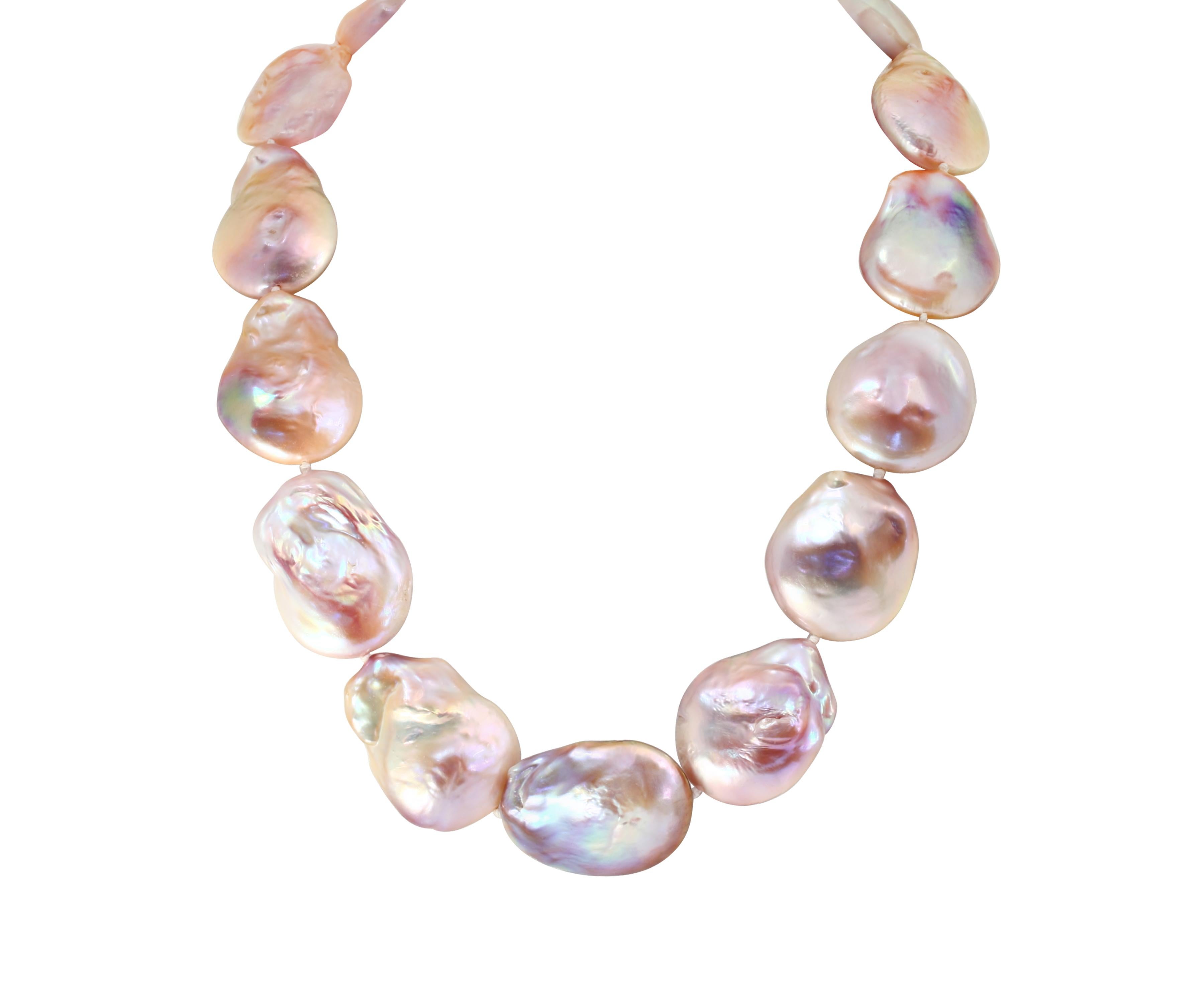 This unique necklace features Chinese freshwater, baroque, natural color pink cultured pearls. The pearls are large, flat, baroque shaped and measure 27x29mm. The necklace is finished with a 13mm, brushed sterling silver yellow ball clasp and is 18