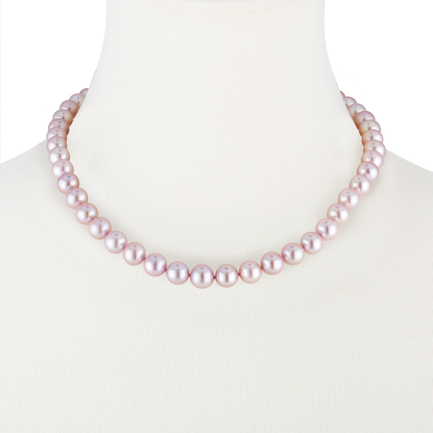 This exquisite Chinese freshwater cultured pearl necklace features distinctive, lustrous, natural color pink round pearls measuring 8.5x9.5mm. The necklace is strung with a classic 14K white gold filigree clasp.
This necklace makes the perfect