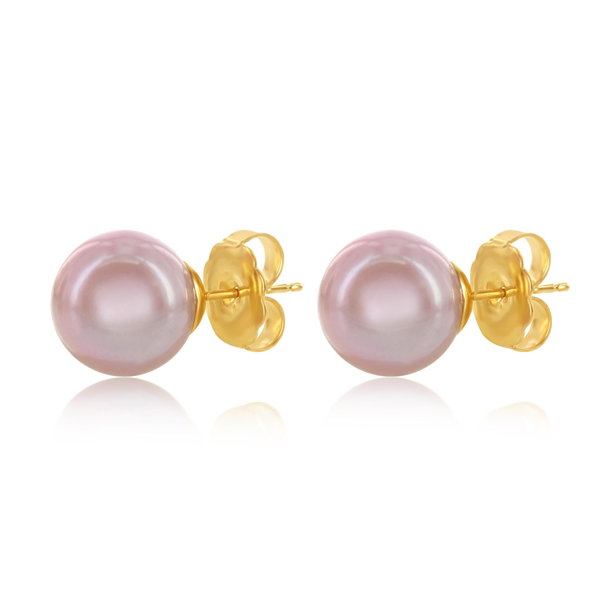 These Chinese freshwater cultured pearls are an exquisite natural pink color. 
The round pearls measure 9-9.5mm and are set on 14 karat yellow gold.
These earrings are great for everyday casual elegance or dressing up!