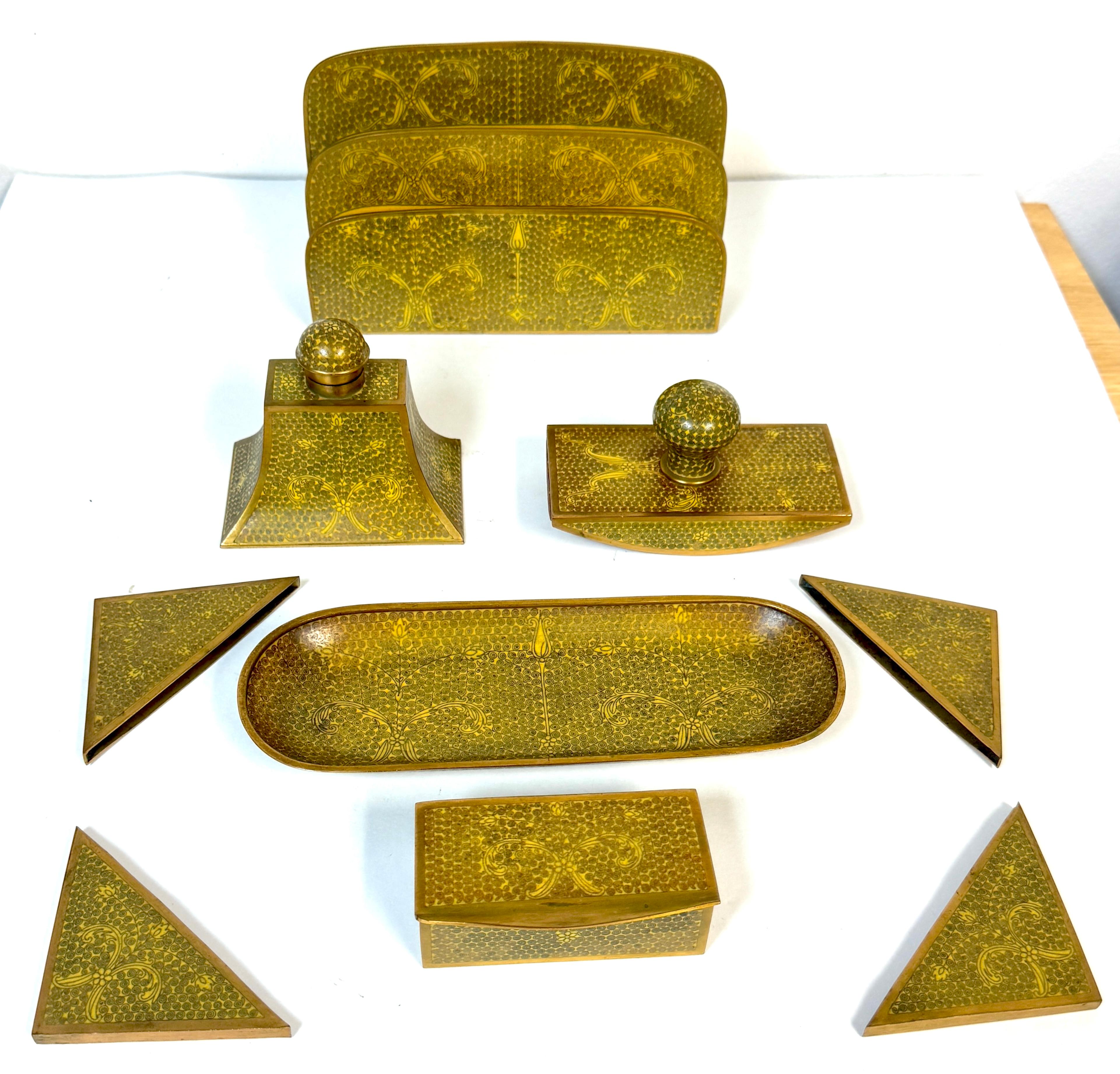 Chinese Gilt Brass Cloisonné “Scroll and Floral” Nine‑Piece Desk Set, 20th Century, Unmarked

A rare and complete nine‑piece Chinese gilt brass cloisonné desk set, exquisitely decorated with an allover repeating scrollwork and floral motif in yellow
