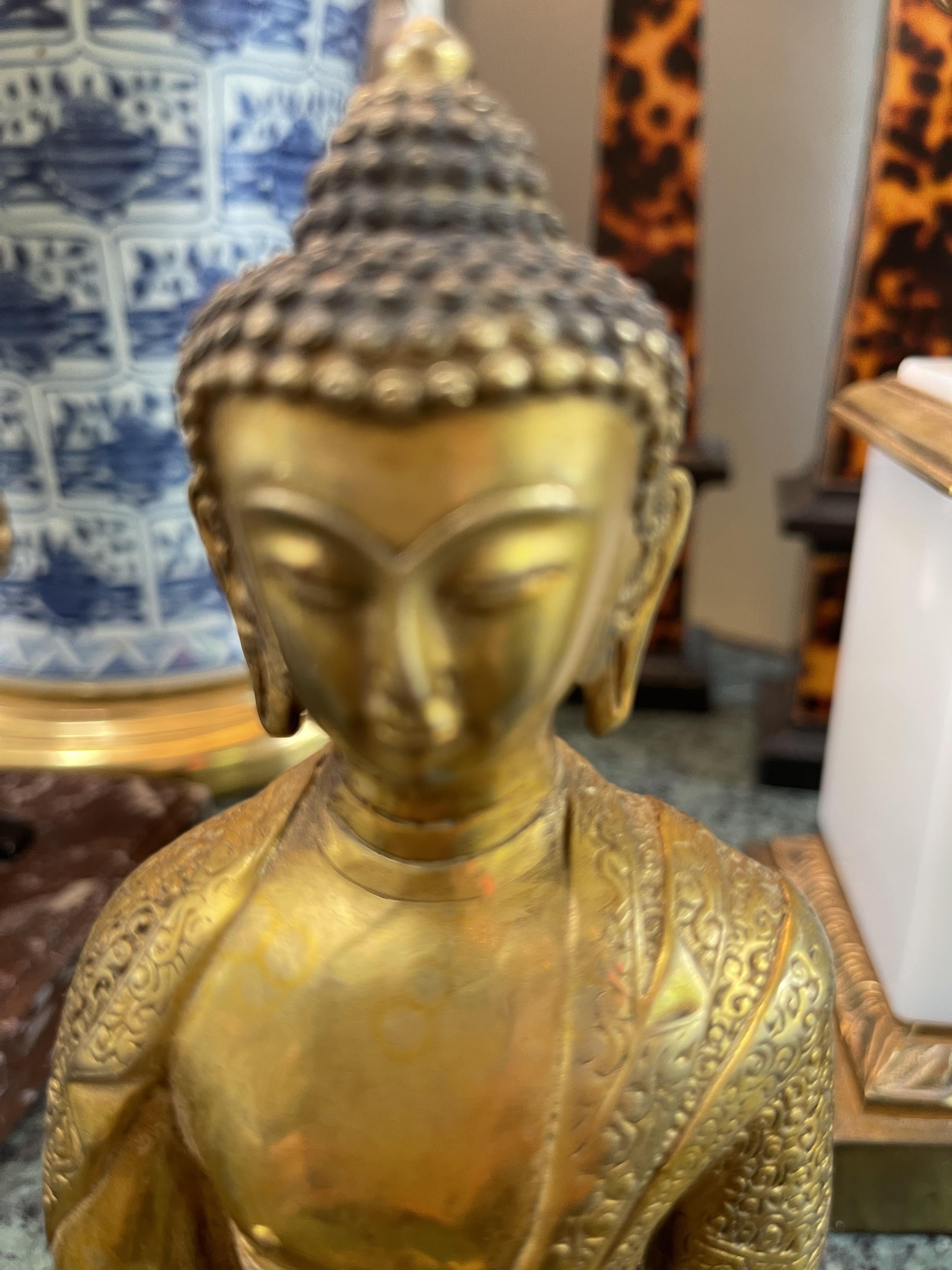 Figura di Buddha cinese in bronzo dorato
7 7/8 H. X 3 3/8 D.