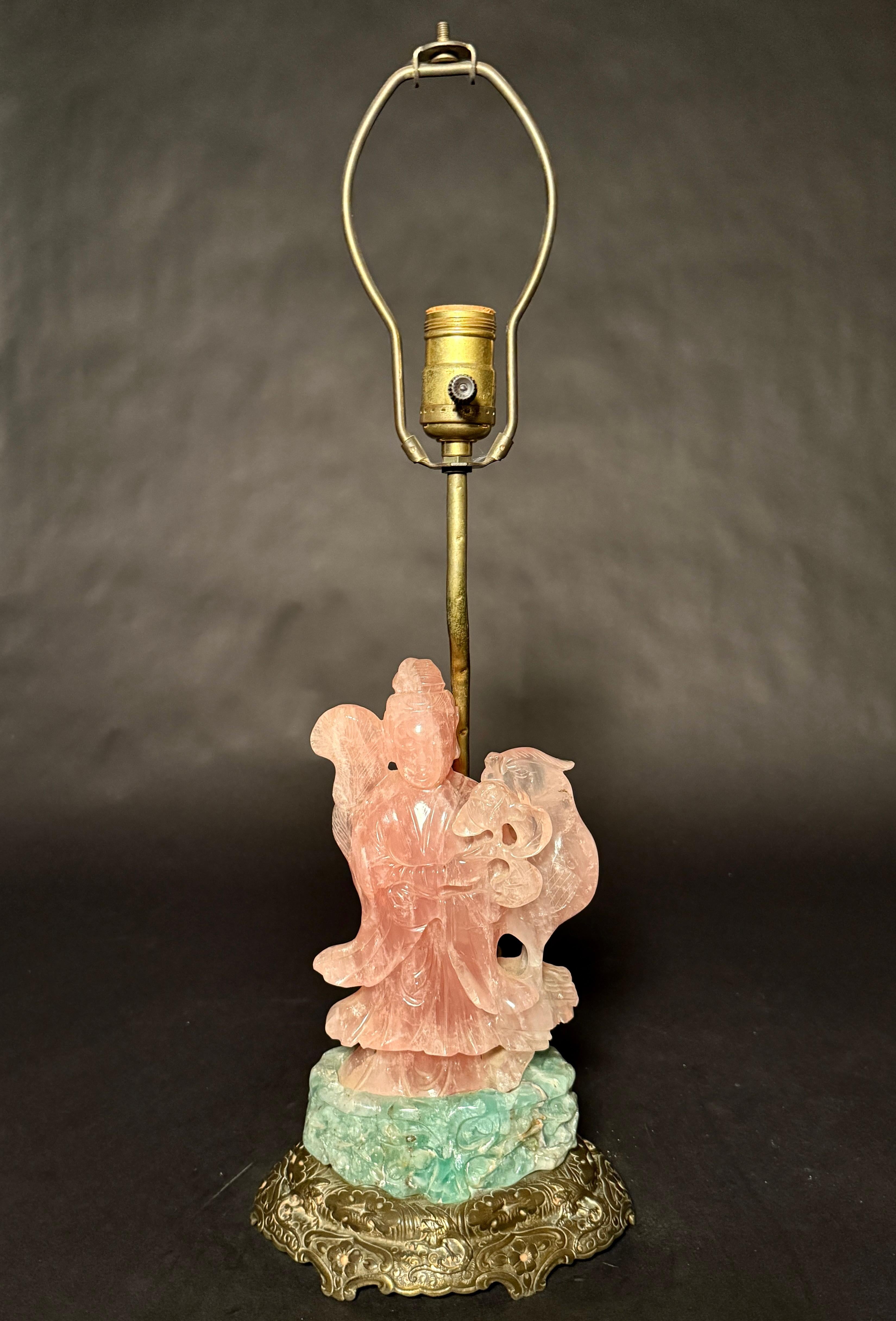 19th century antique Chinese hand-carved and polished translucent rose quartz carving of a standing Guanyin with phoenix bird, mounted on a carved green quartz plinth. Mounted as a lamp with original brass bass circa 1910.
22