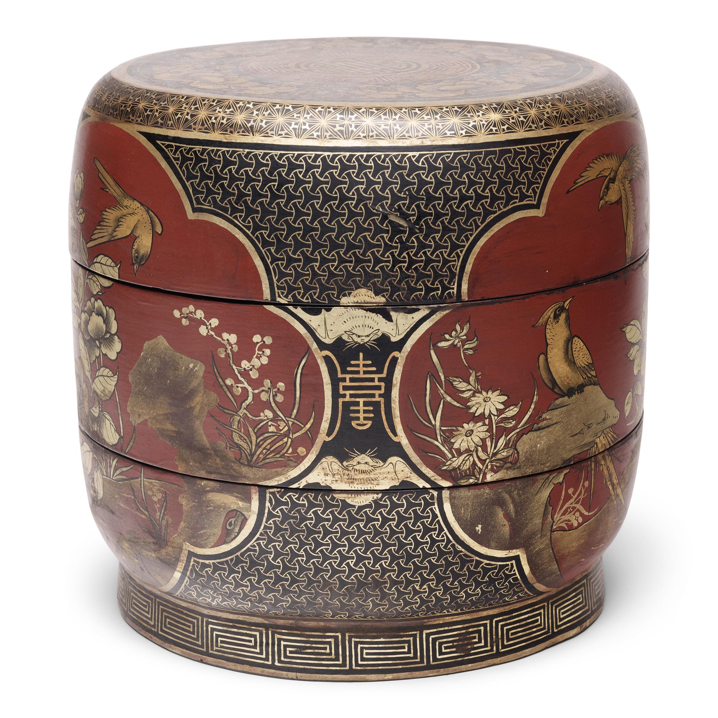 This finely painted box was once presented as a gift, filled with popular snacks like roasted melon seeds, dried fruit, and cinnamon-toasted soy beans. Used like a modern lunchbox, each tier of the stacking box would have been filled with foods and