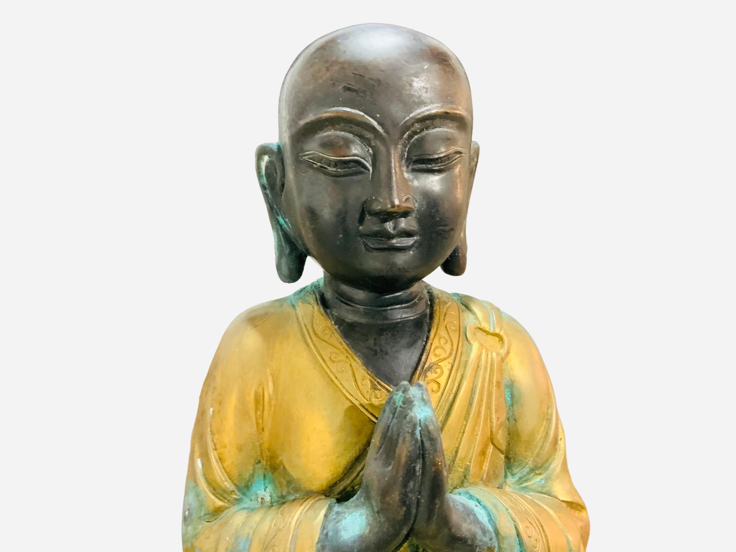 20th Century Chinese Gilt Patinated Bronze Small Sculpture of a Luohan For Sale