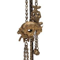 Chinese Gilt Repoussé String of Charms, c. 1900