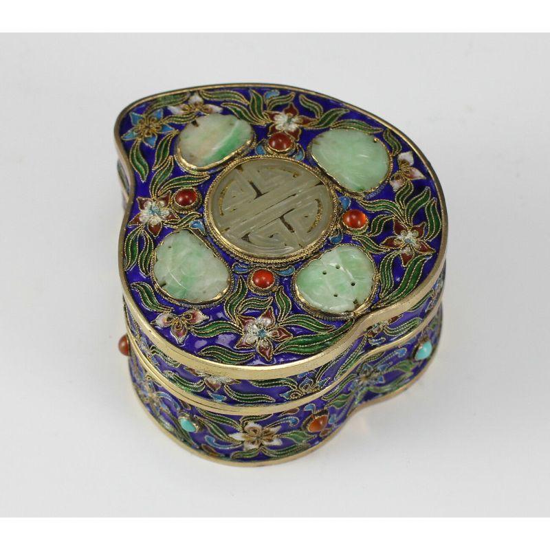 Chinese Gilt Silver Cloisonne Box with Jade medallions, circa 1900, jeweled with jade, carnelian Shaded enamel, Elevated wires. Heart shape.

Additional information:
Color: Multi-Color 
Type: Boxes
Primary Material: Silver 
Age:
