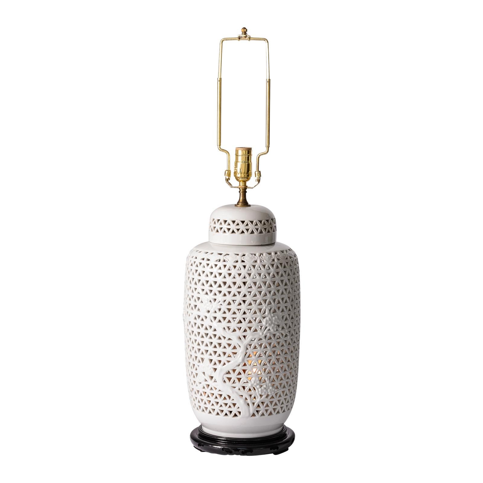 Just in this pair of Chinese Blanc de Chine porcelain table Lamps, with  pierced  reticulated decor. and a Ginger Jar form.
They stand on Black Lacquer Wood bases.
Recently rewired
31