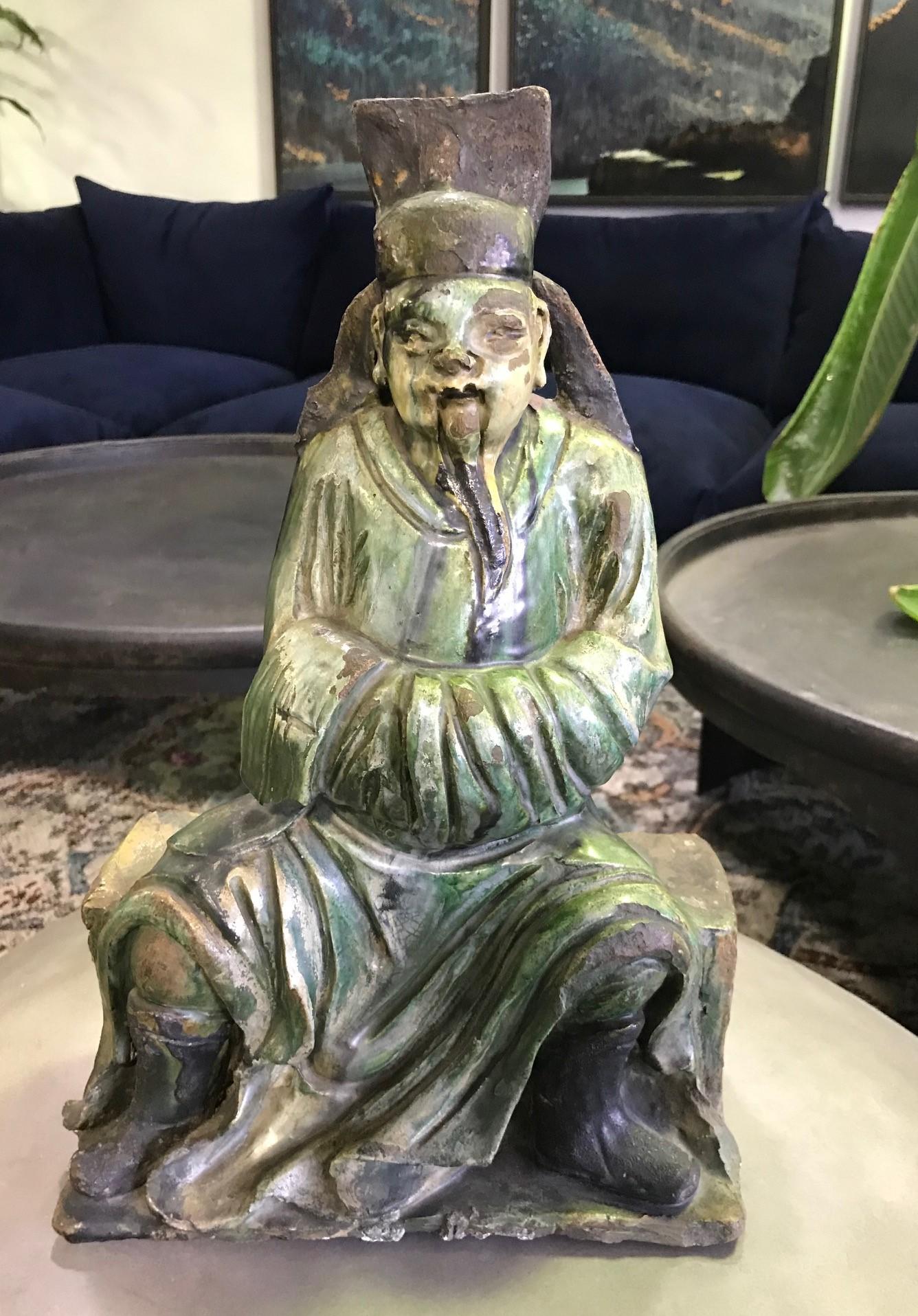 A fantastic piece. Wonderfully glazed and colored work of a seated elderly gentleman or mythical figure. 

From a Bel Air, California high-end art and artifacts estate.

We were told it is likely Ming Dynasty but this is not our area of