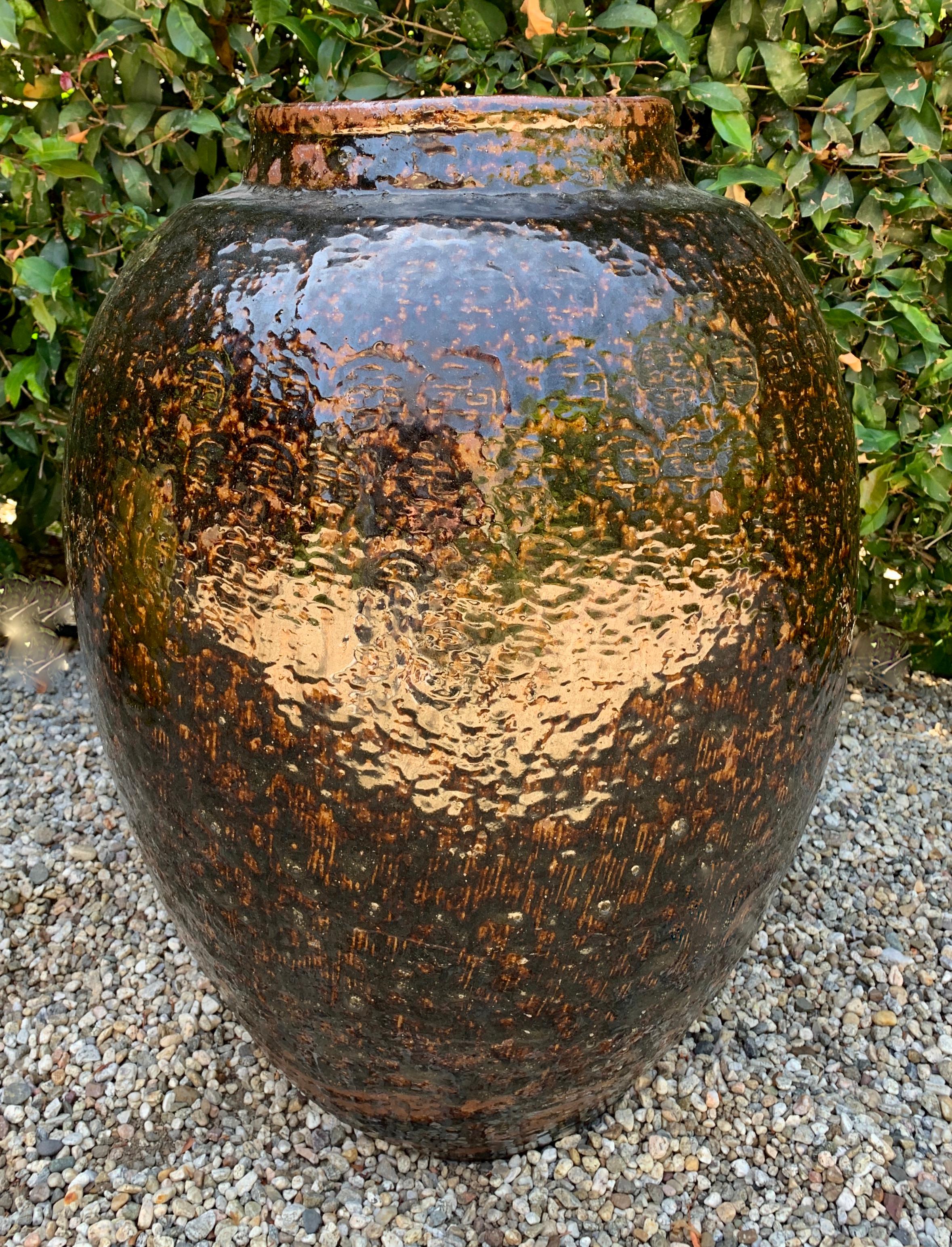 Chinese glazed terracotta urn or planter - a wonderful glazed container for the garden or interior. A heavy glaze with some motifs showing through.