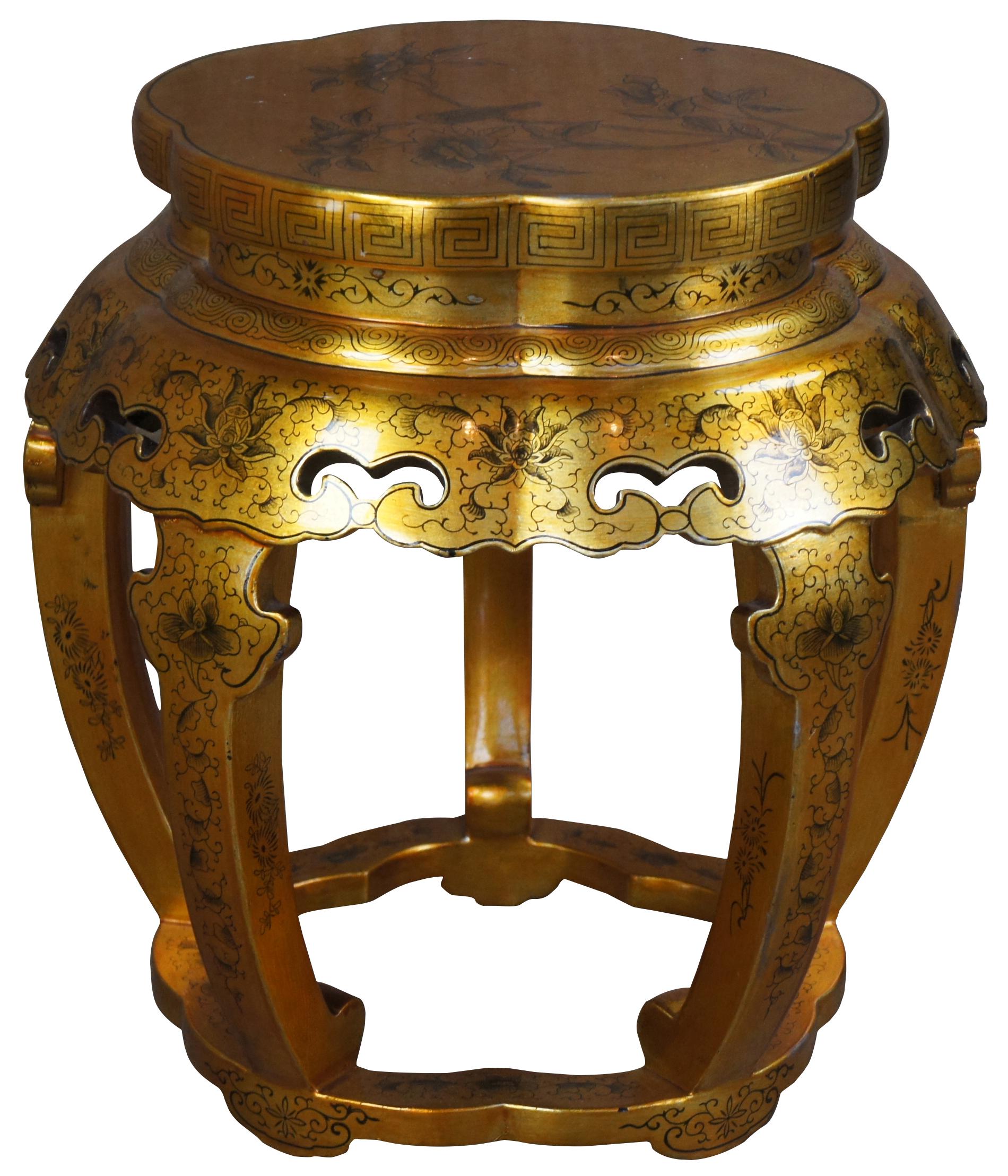 Vibrant 20th century gold and black oriental gardent stool or stand. An elaborate design with a pierced apron with flowing flowers, scrolling clouds and Greek key trim. Features a bird perched along the top.
  